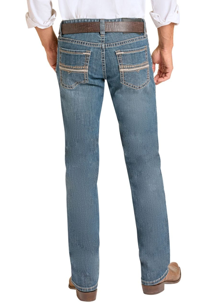 Man wearing a white shirt, blue jeans, and cowboy boots on a white background