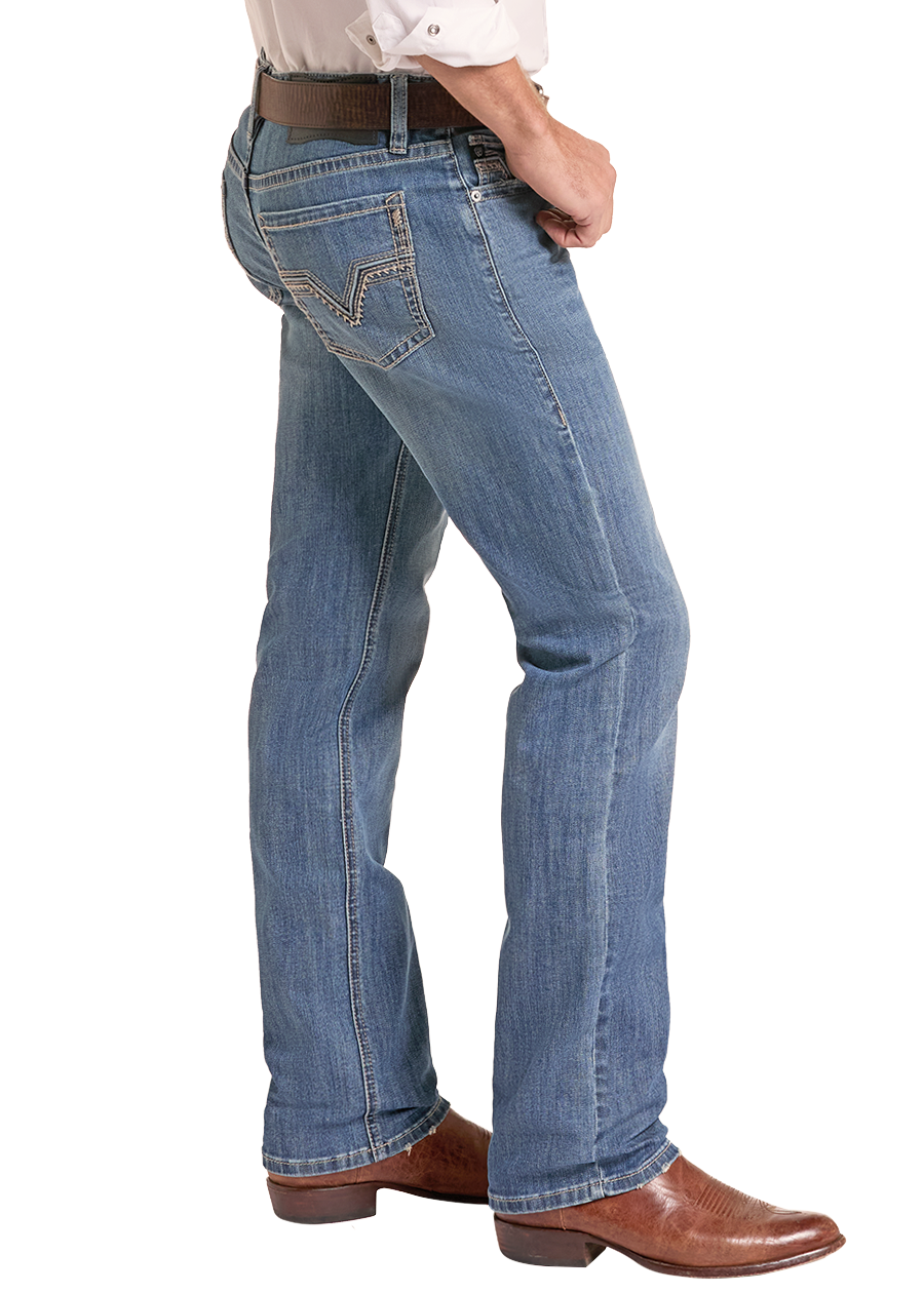 A man shown from the side wearing a tan cowboy hat, a white long-sleeve button-up shirt, blue jeans, a brown belt, and brown leather boots against a plain white background.
