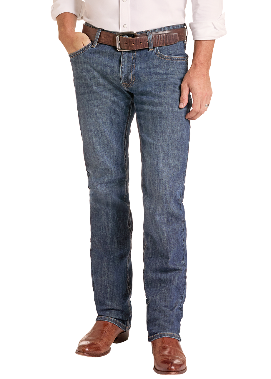 A man modeling a light-colored western long-sleeve button-down shirt, blue jeans, a brown belt, brown boots, and a tan cowboy hat against a plain white background.