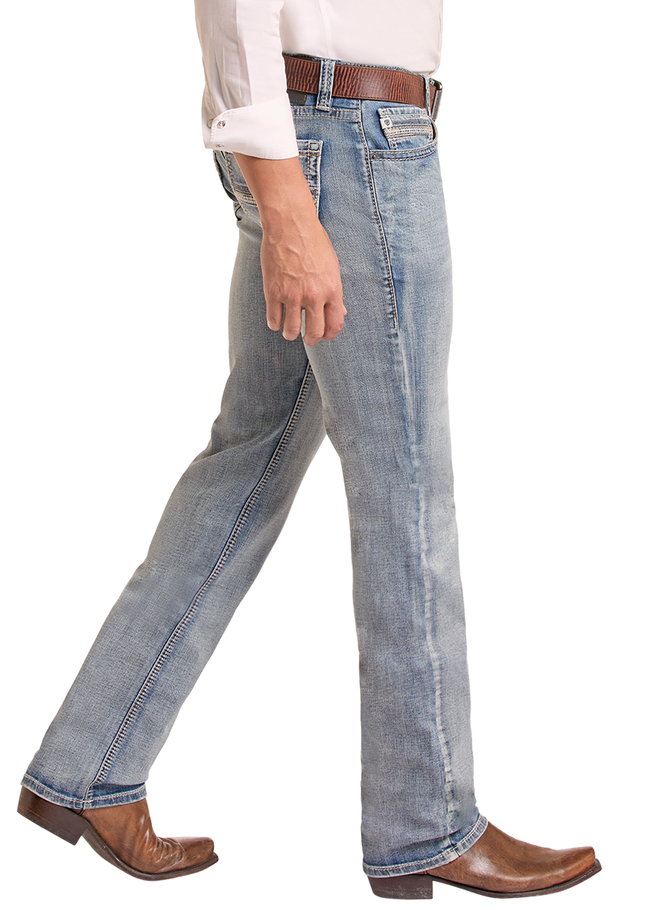 A man wearing a light pink western long-sleeve shirt, light blue jeans, brown boots, and a brown cowboy hat, shown in profile against a white background.