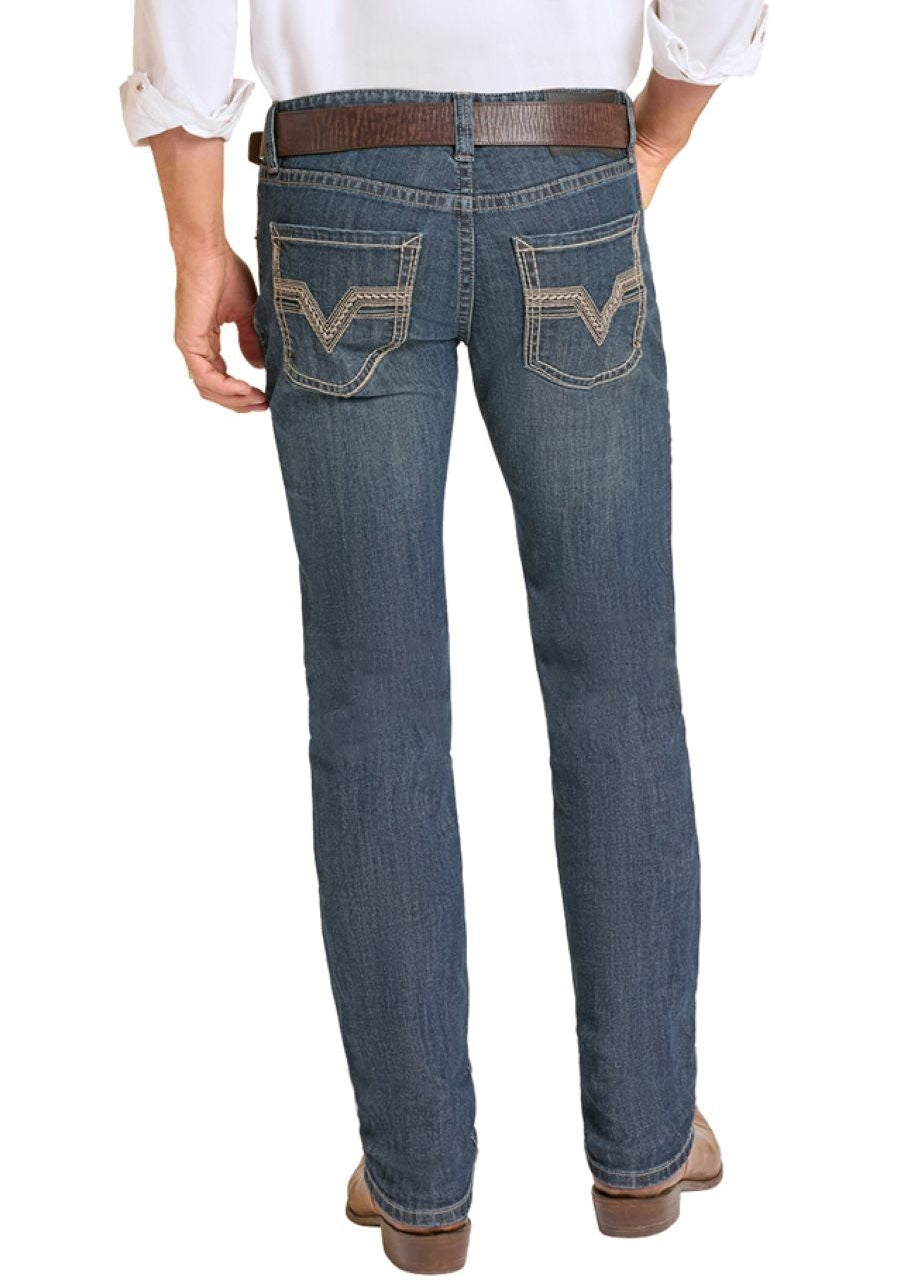 Man wearing a white shirt, blue jeans, and cowboy boots on a white background