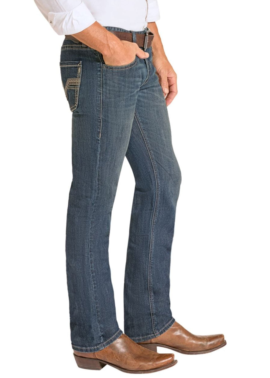 Man wearing a white shirt, blue jeans, and cowboy boots on a white background