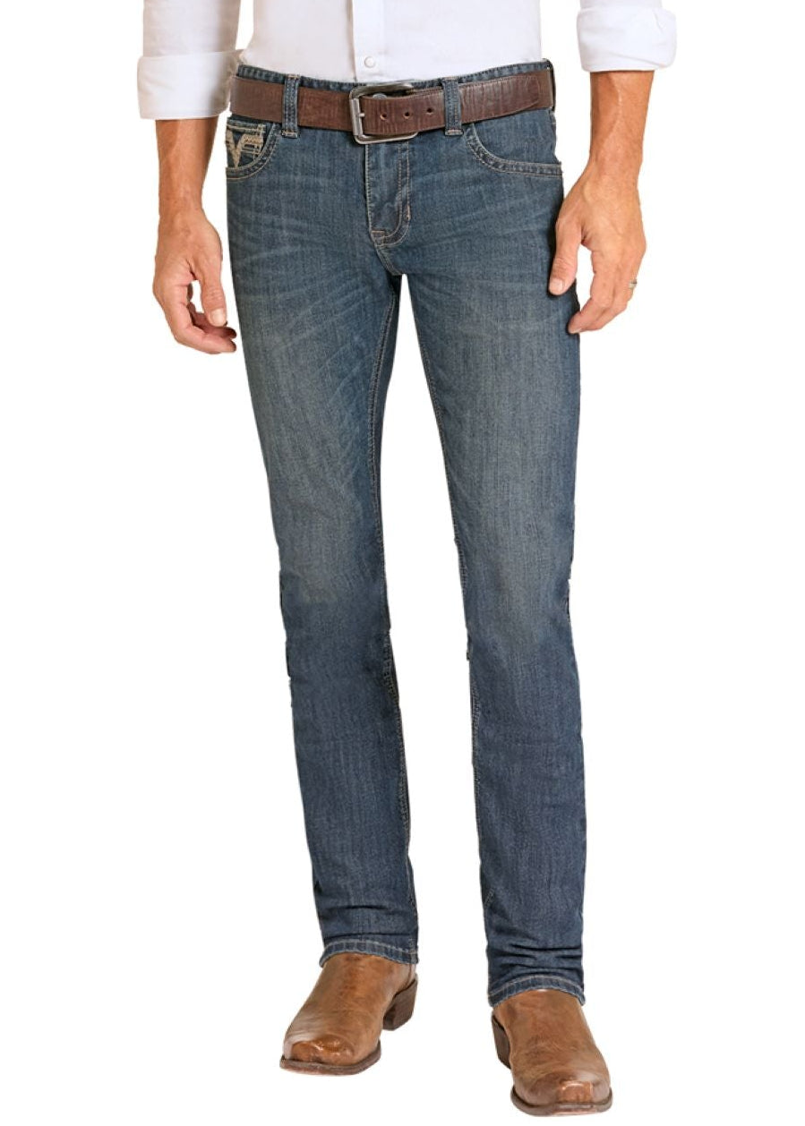 Man wearing a white shirt, blue jeans, and cowboy boots on a white background