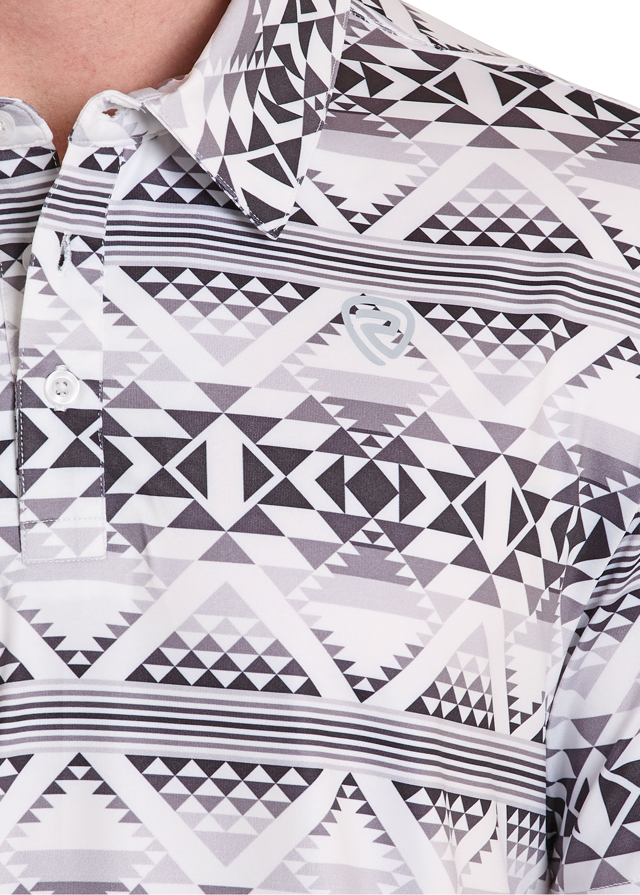 Close-up of a patterned polo shirt with geometric designs in black and white.