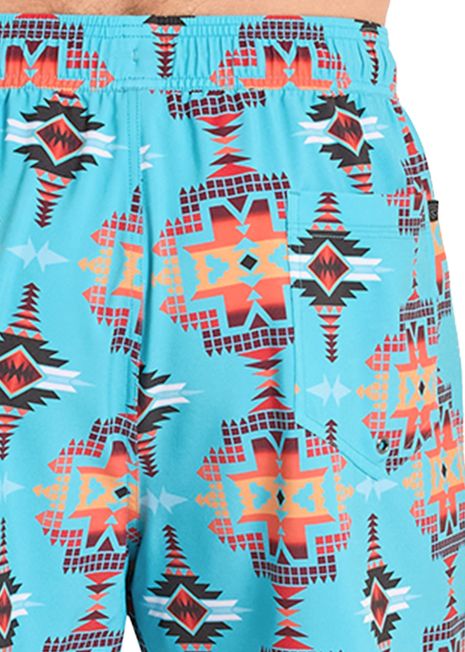 Blue swim shorts with geometric pattern worn by a person