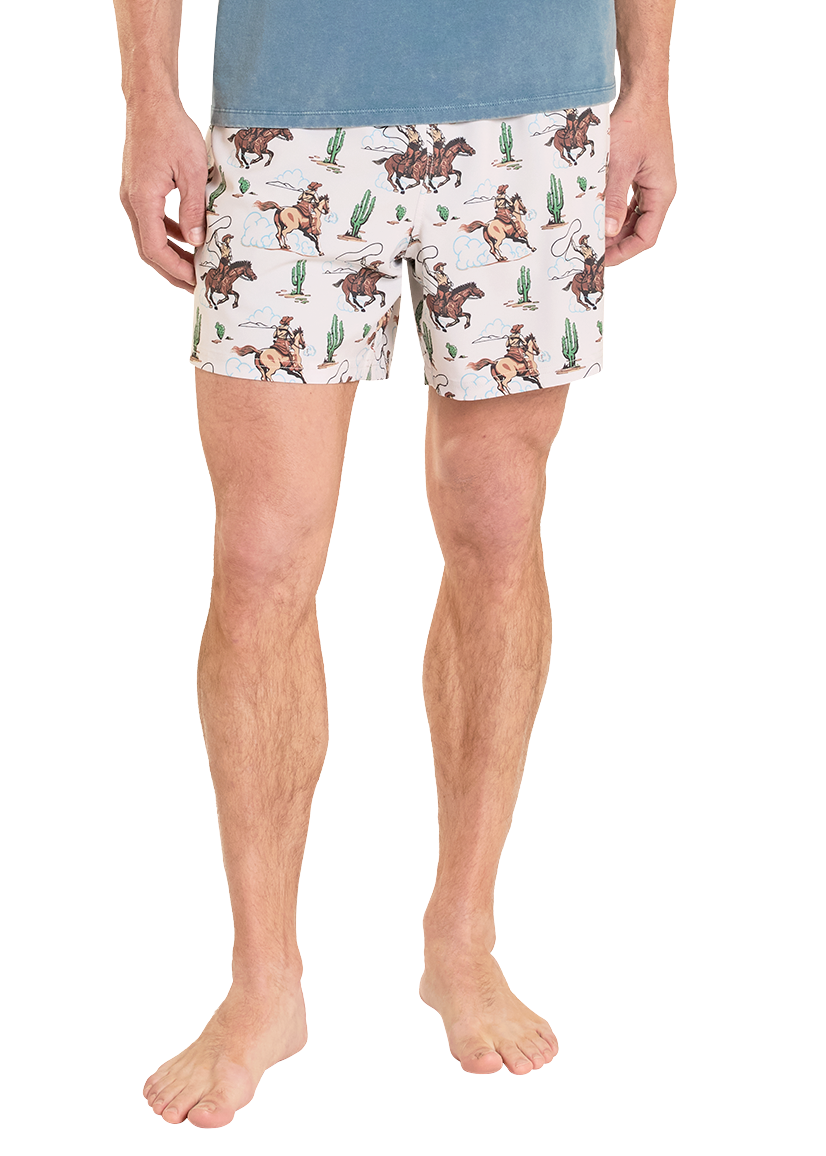 Person wearing patterned shorts with a white background