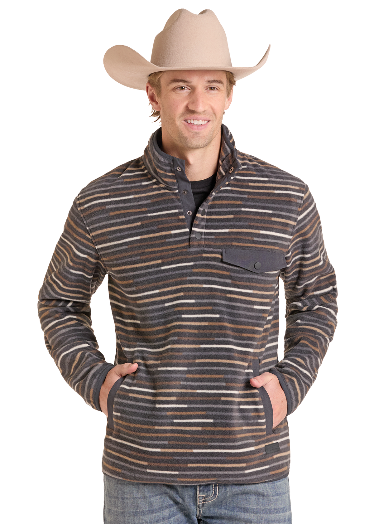 A man wearing a beige cowboy hat and a striped quarter-zip fleece pullover sweater with blue jeans, standing against a white background.