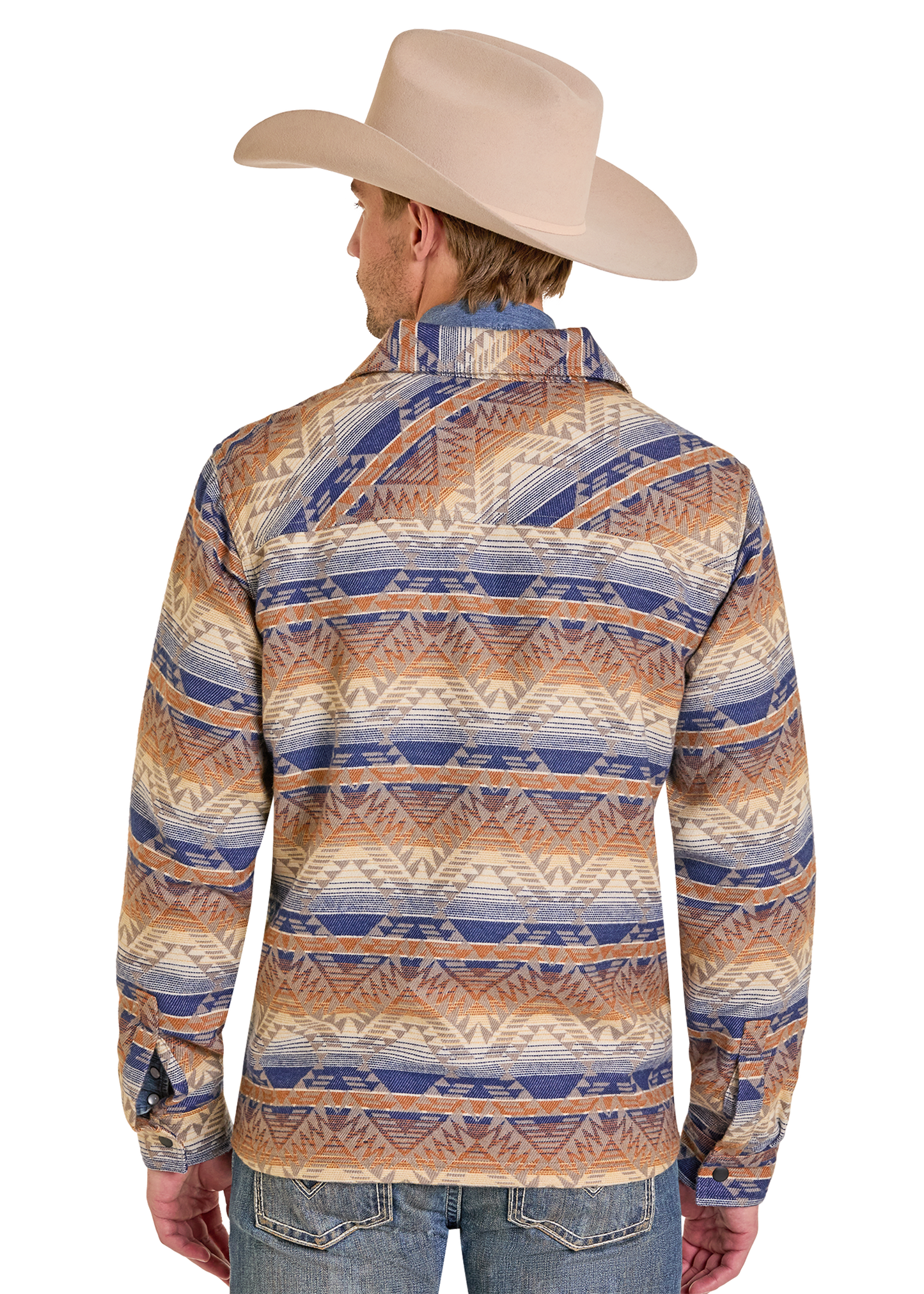 The back of a man wearing a cowboy hat and an Aztec shirt jacket. 