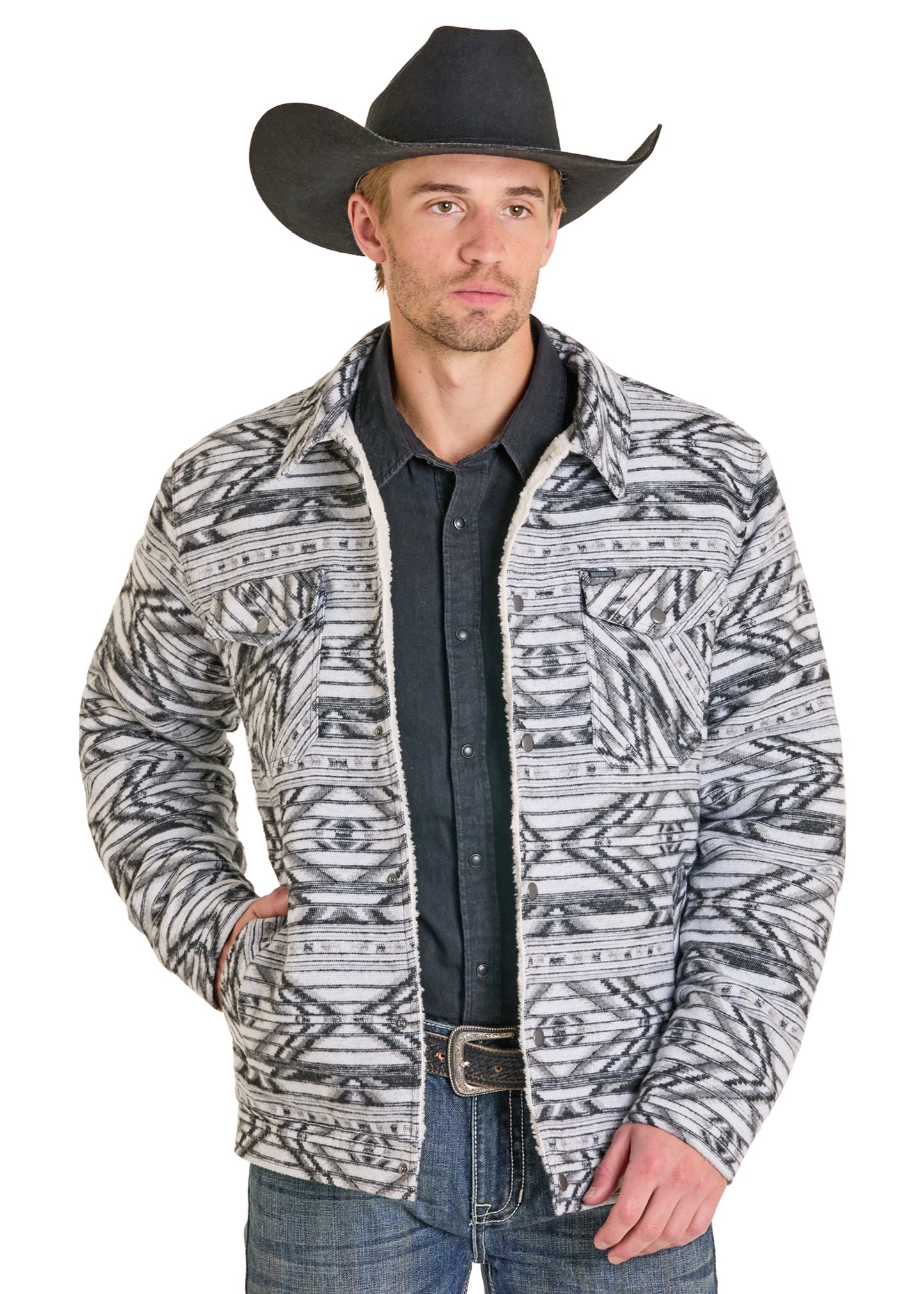 Man wearing a patterned jacket, black shirt, and cowboy hat on a white background