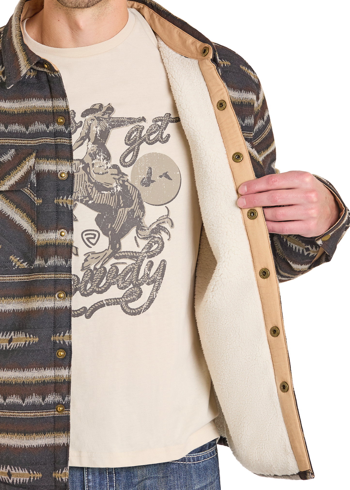 Person wearing a patterned jacket over a graphic t-shirt with text and graphics.