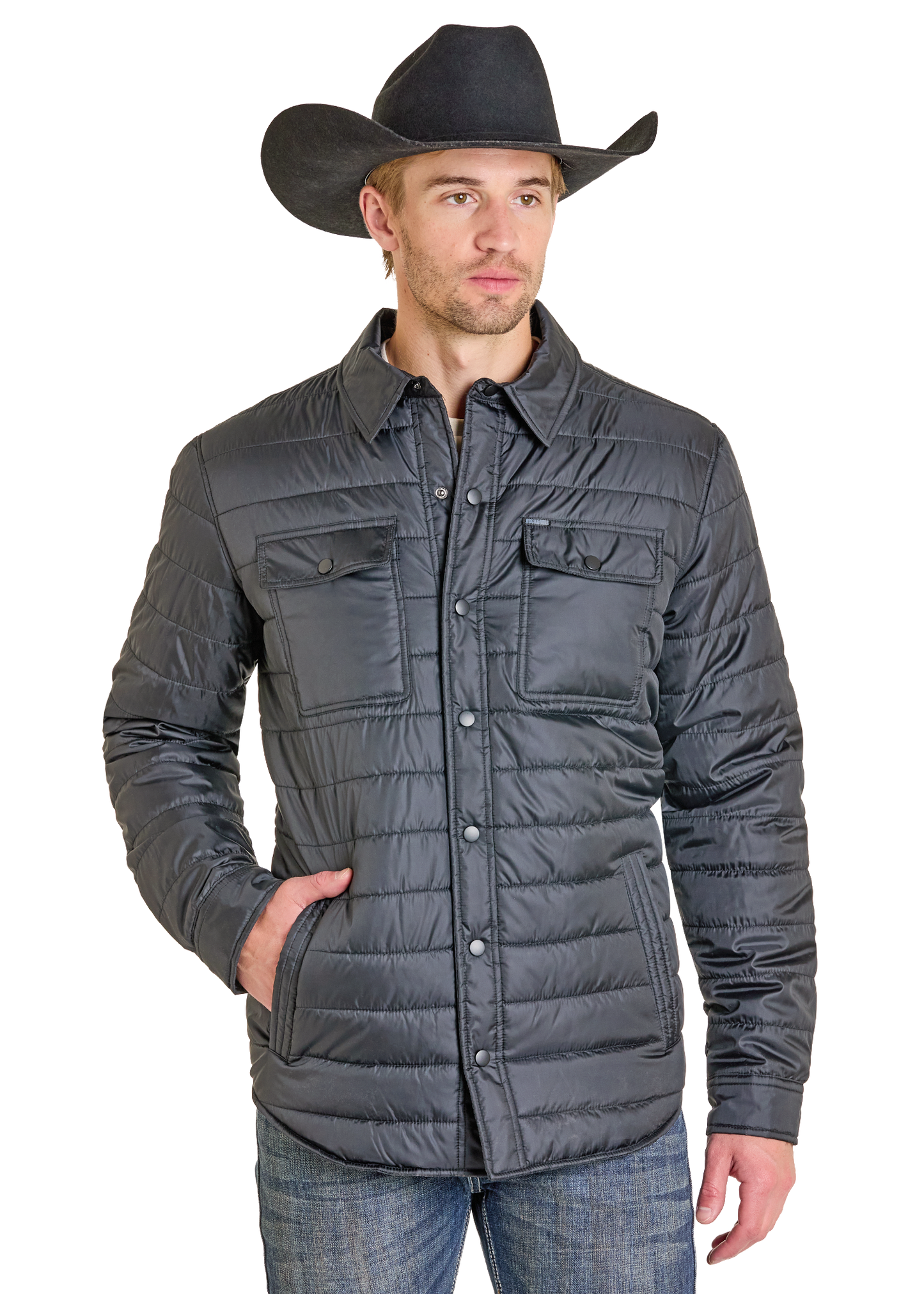 A man in a black cowboy hat, blue jeans, and the Rock & Roll Denim Puffer Print Lined Shirt Jacket with snap buttons and chest pockets stands with one hand in his pocket against a white background.