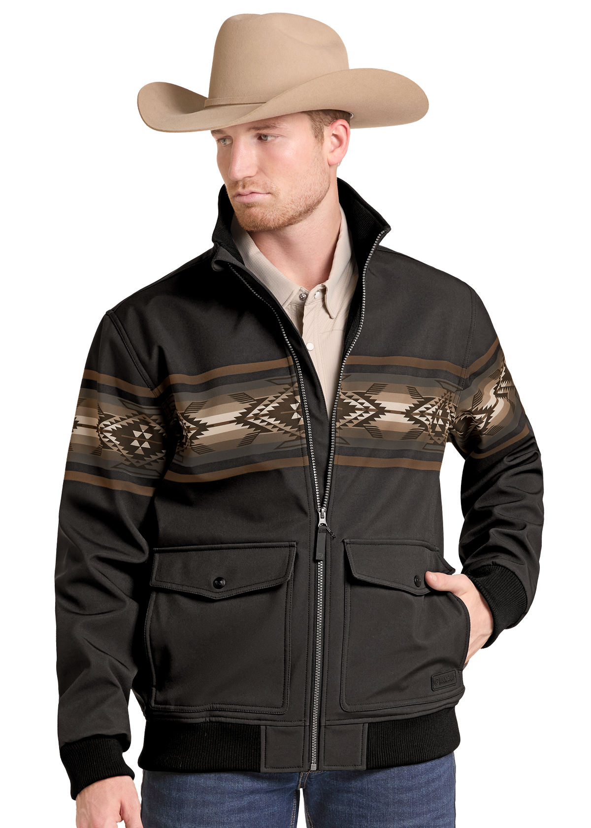 A man wearing a black zip-front western-style jacket with a brown and beige geometric pattern across the chest, a tan cowboy hat, and blue jeans, photographed against a plain white background.