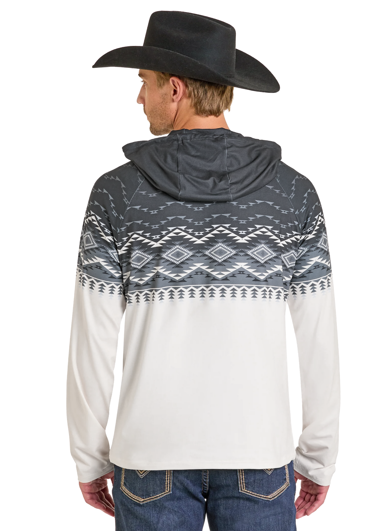 Person wearing a hoodie with a geometric pattern, black cowboy hat, and blue jeans on a white background