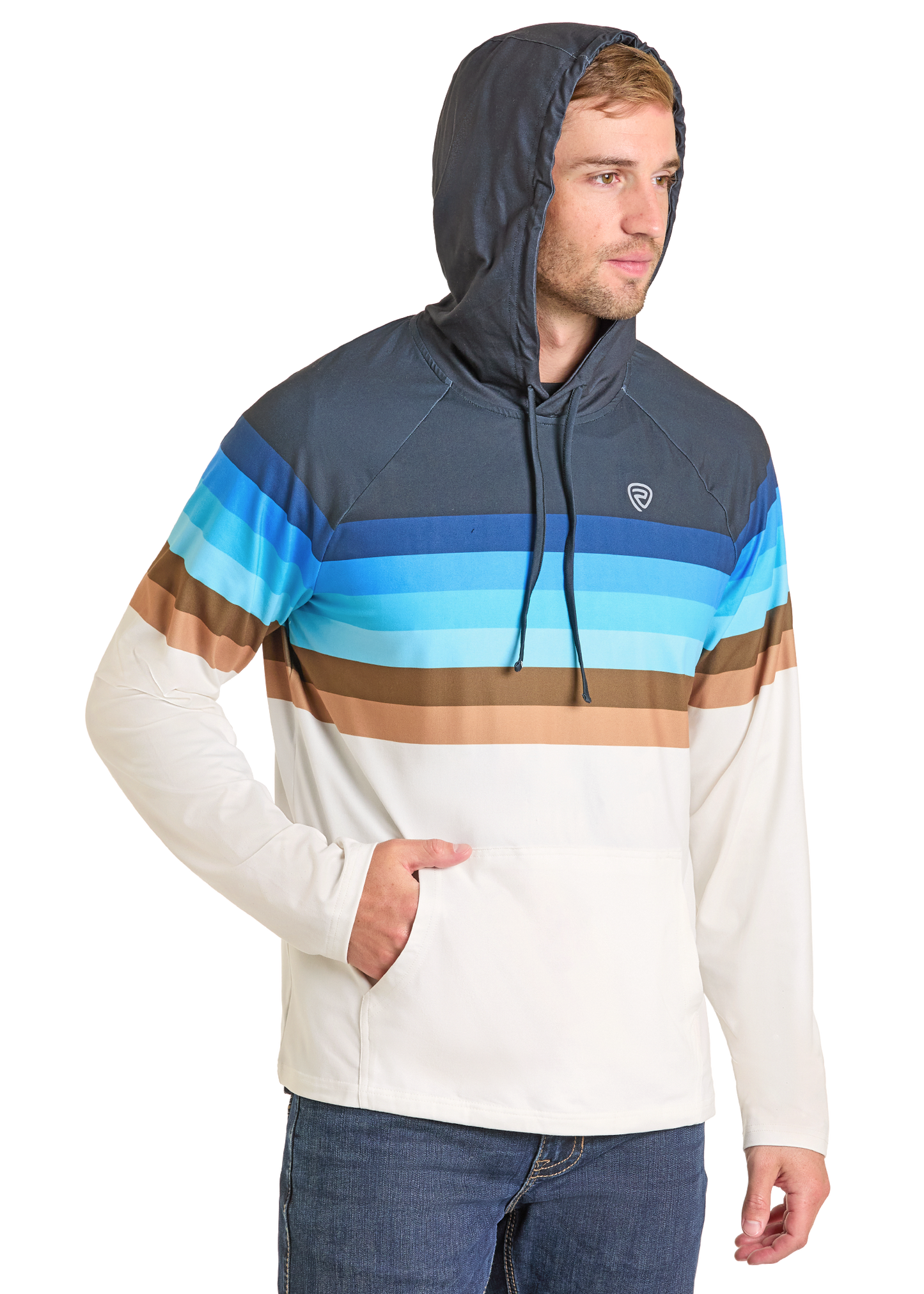 A man in the Rock & Roll Denim Striped Border Performance Hoodie with blue, brown, and white stripes stands with one hand in the front pocket. The moisture-wicking fabric keeps him comfortable. He has light brown hair and wears blue jeans.