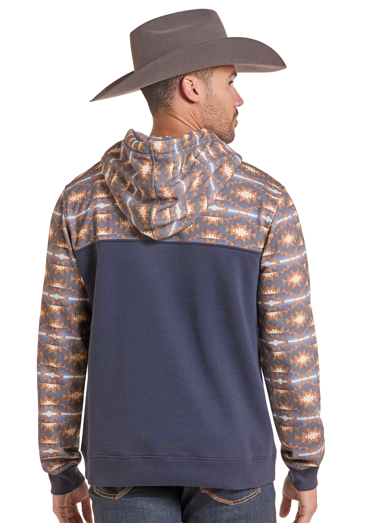 The back of a man in an Aztec and blue hoodie.
