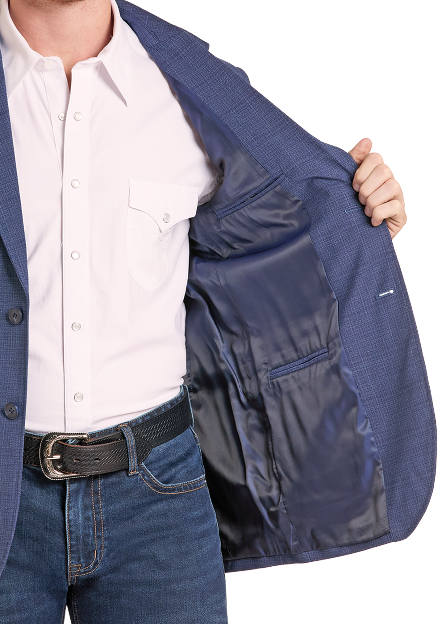 A close-up of a person wearing a navy blue textured blazer over a white dress shirt and blue jeans, opening the blazer to show the interior lining.