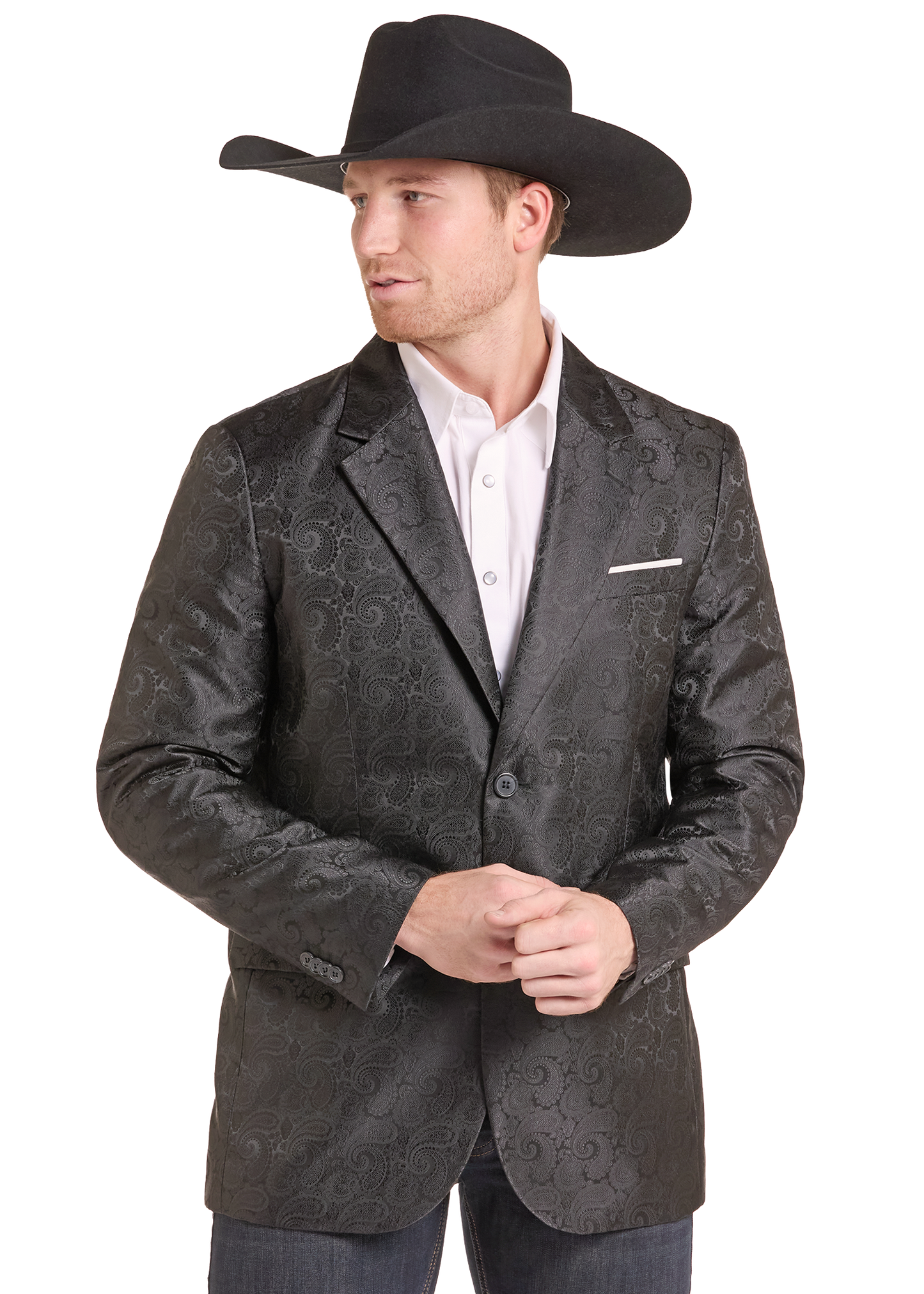 A man wearing a black cowboy hat, a dark gray patterned blazer over a white collared shirt, and jeans, photographed against a plain white background.