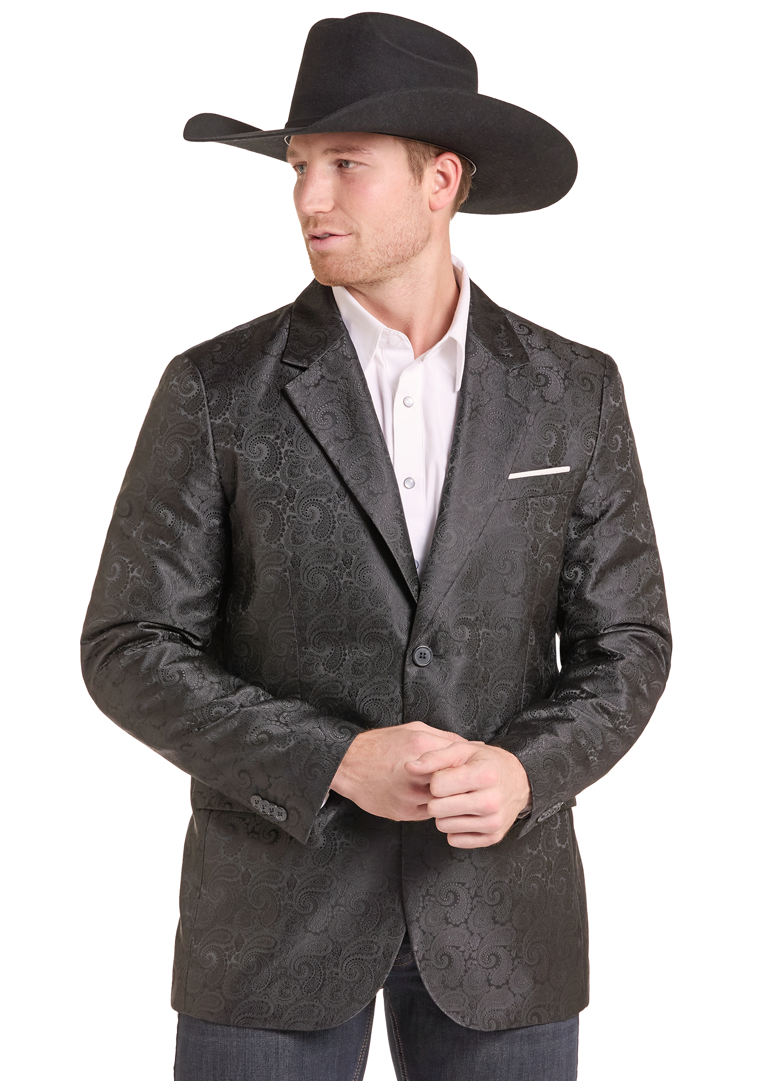A man wearing a black cowboy hat, a dark gray patterned blazer over a white collared shirt, and jeans, photographed against a plain white background.