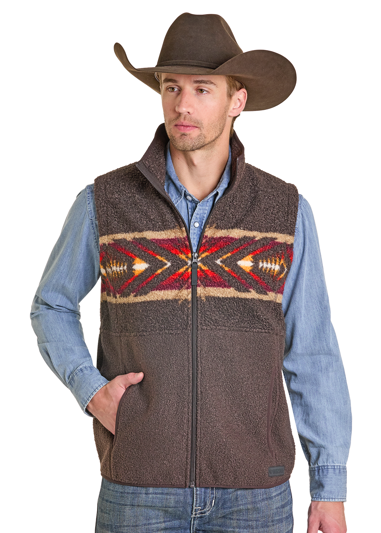 Man wearing a brown patterned vest over a blue shirt with a cowboy hat on a white background