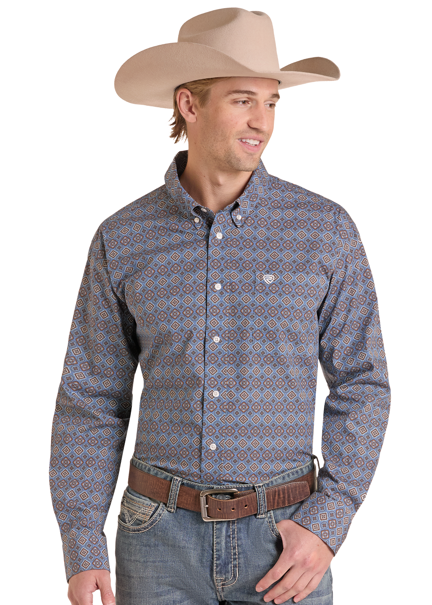 A man wearing a long-sleeve western button-down shirt with a blue, orange, and white geometric pattern, paired with a tan cowboy hat, brown belt, and blue jeans, set against a plain white background.