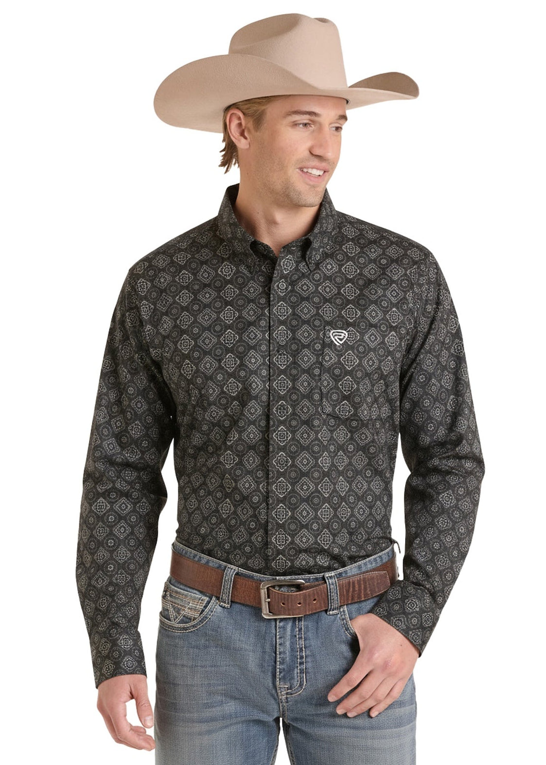 A man wearing a dark gray long-sleeve western shirt with a small white embroidered logo on the chest, paired with a tan cowboy hat, brown belt, and blue jeans, set against a plain white background.