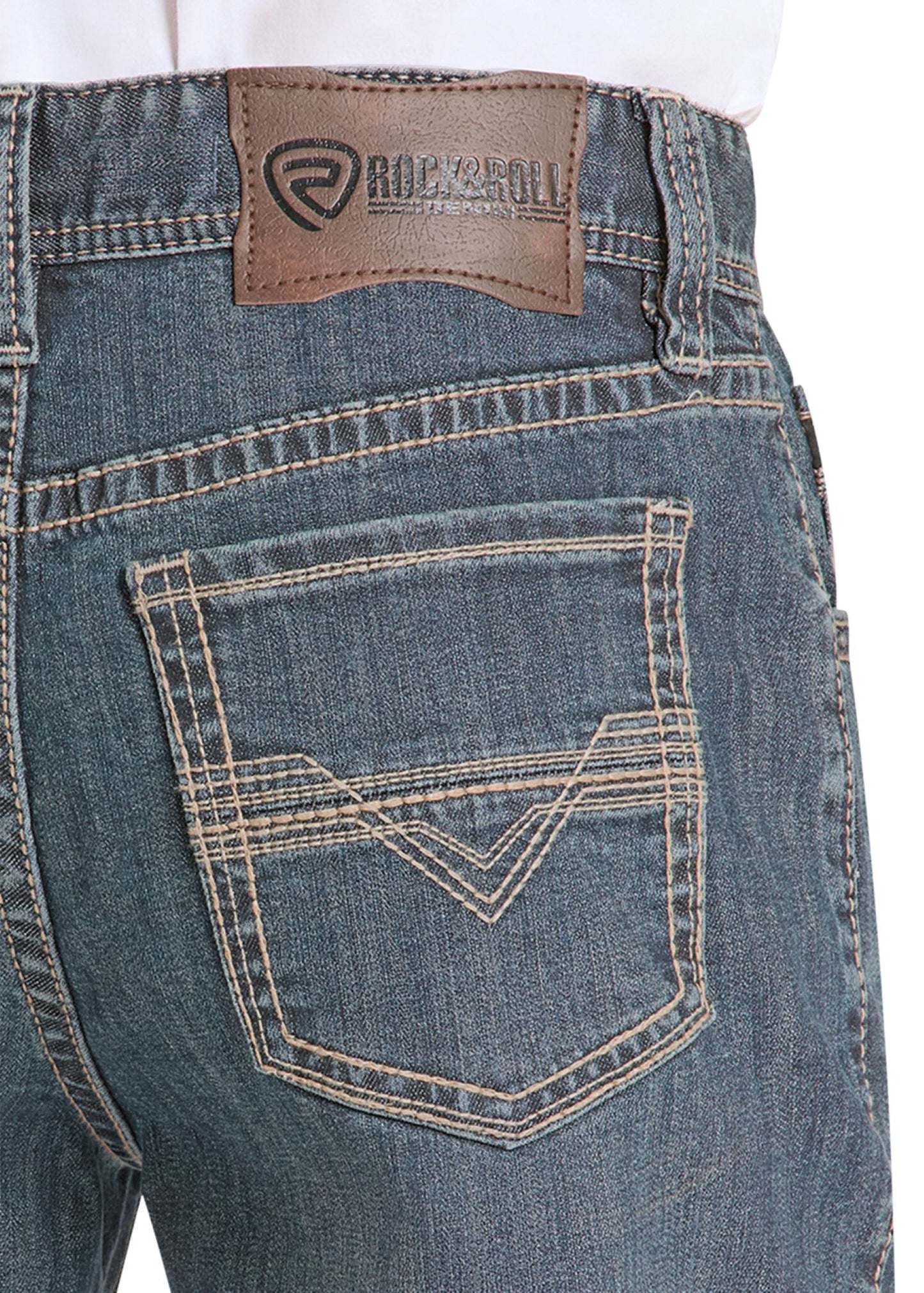 Close-up of blue jeans with a brand label on the back pocket against a white background