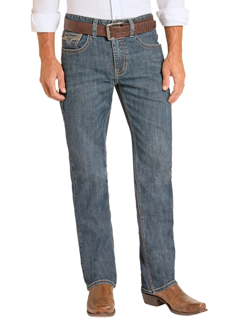 Man wearing a white shirt, blue jeans, and cowboy boots on a white background