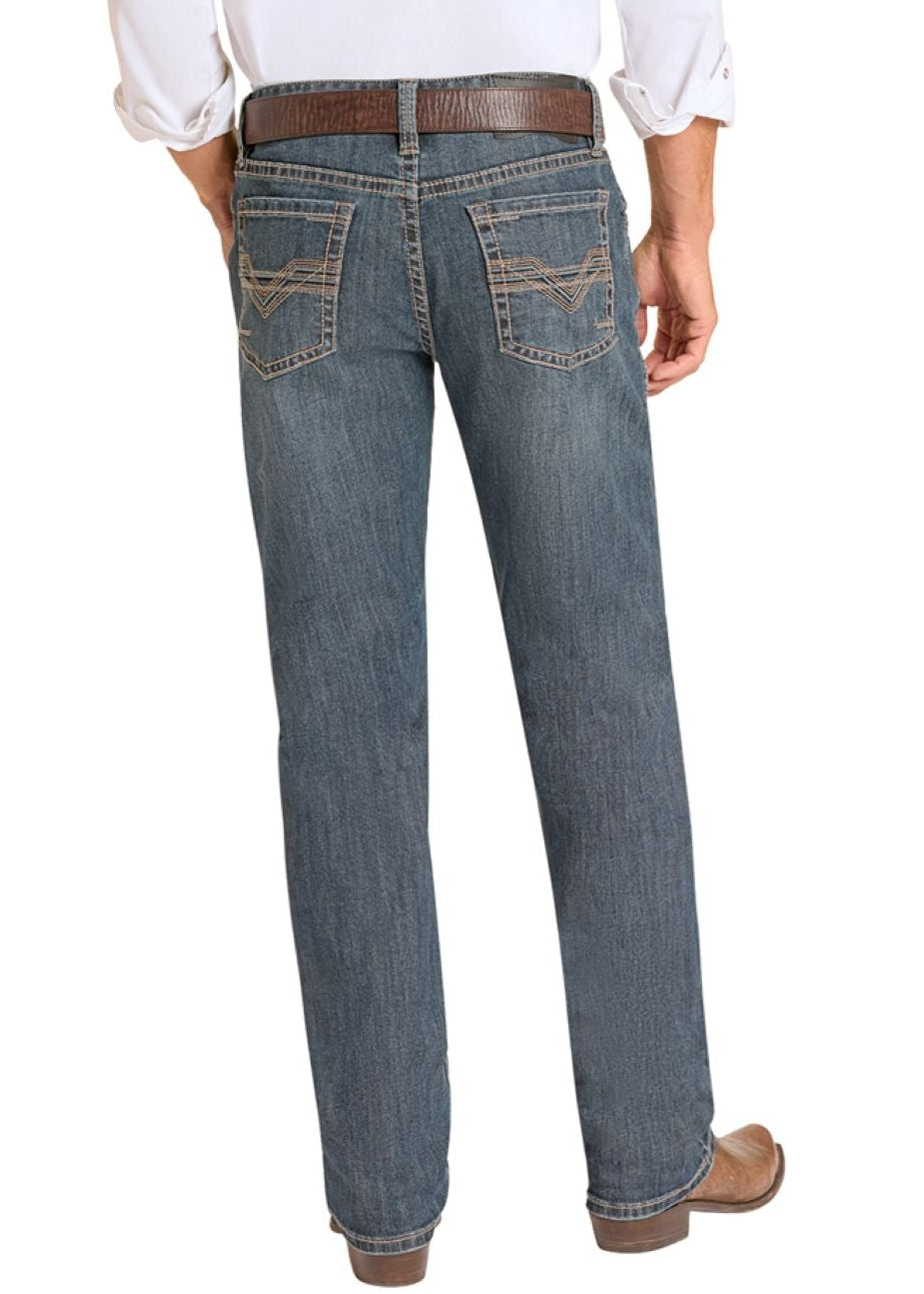 The back of a man wearing a white shirt, blue jeans and cowboy boots.