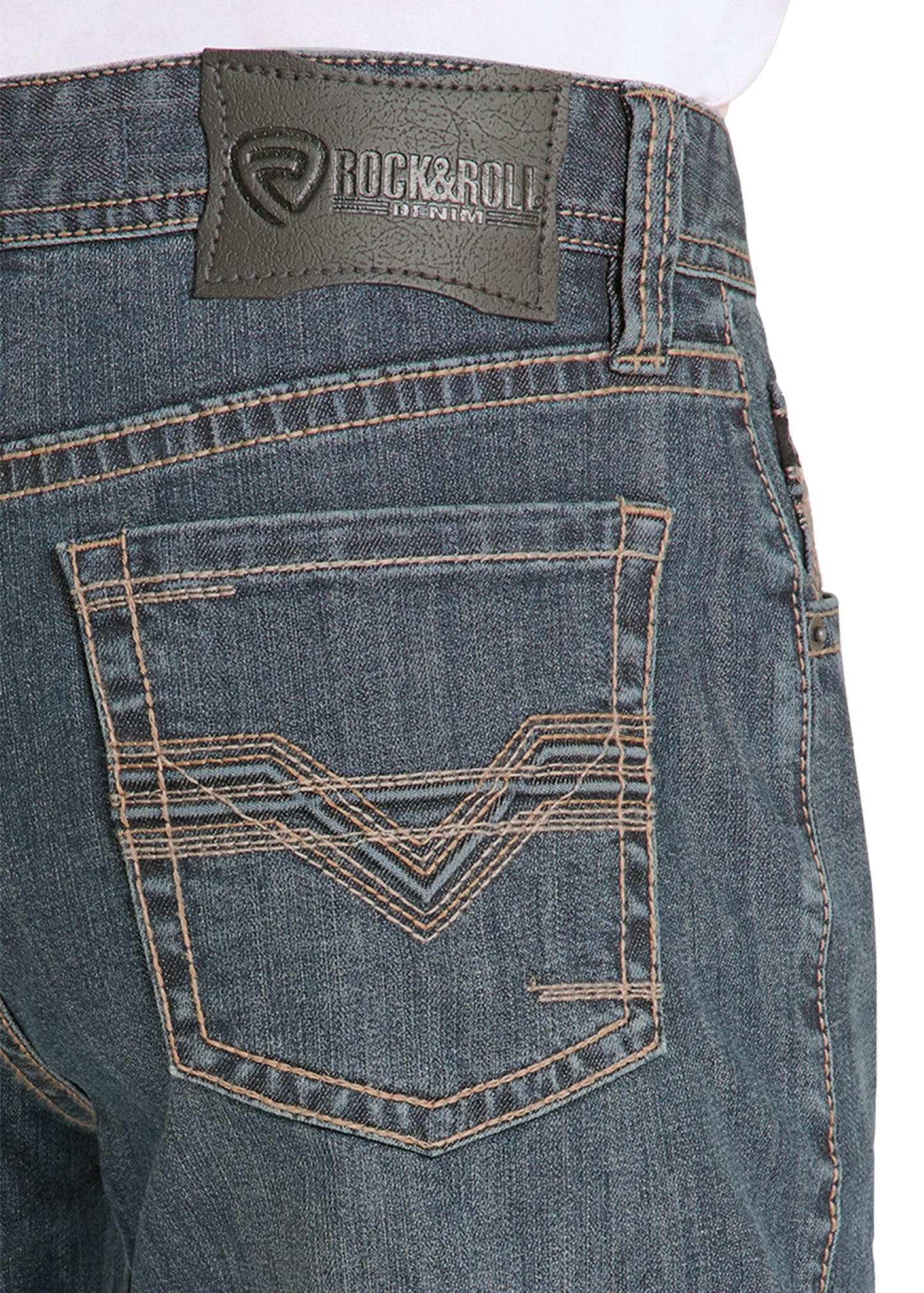 Close-up of blue jeans with a brand label on the pocket area.