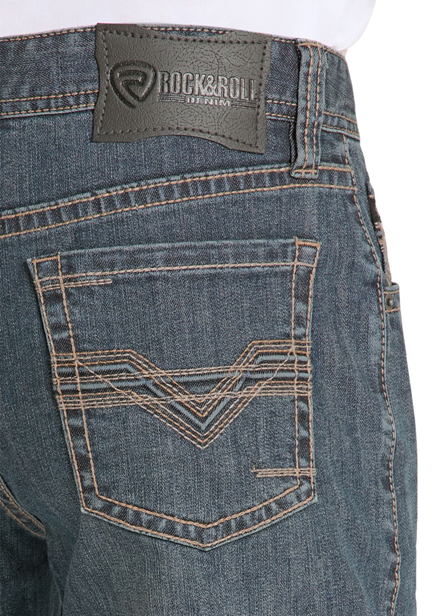 Close-up of blue jeans with a brand label on the pocket area.