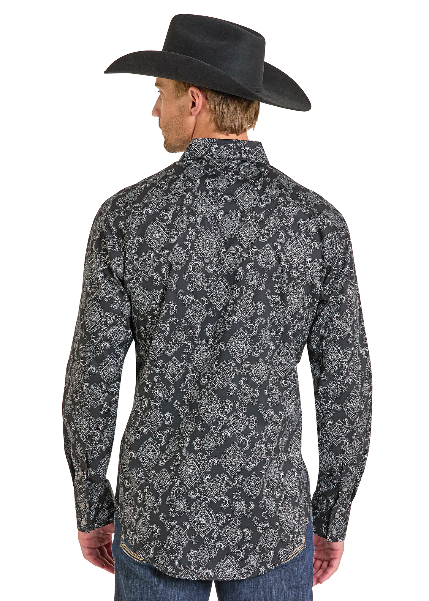 The back of a man wearing a cowboy hat and a pattered pearl snap shirt. 