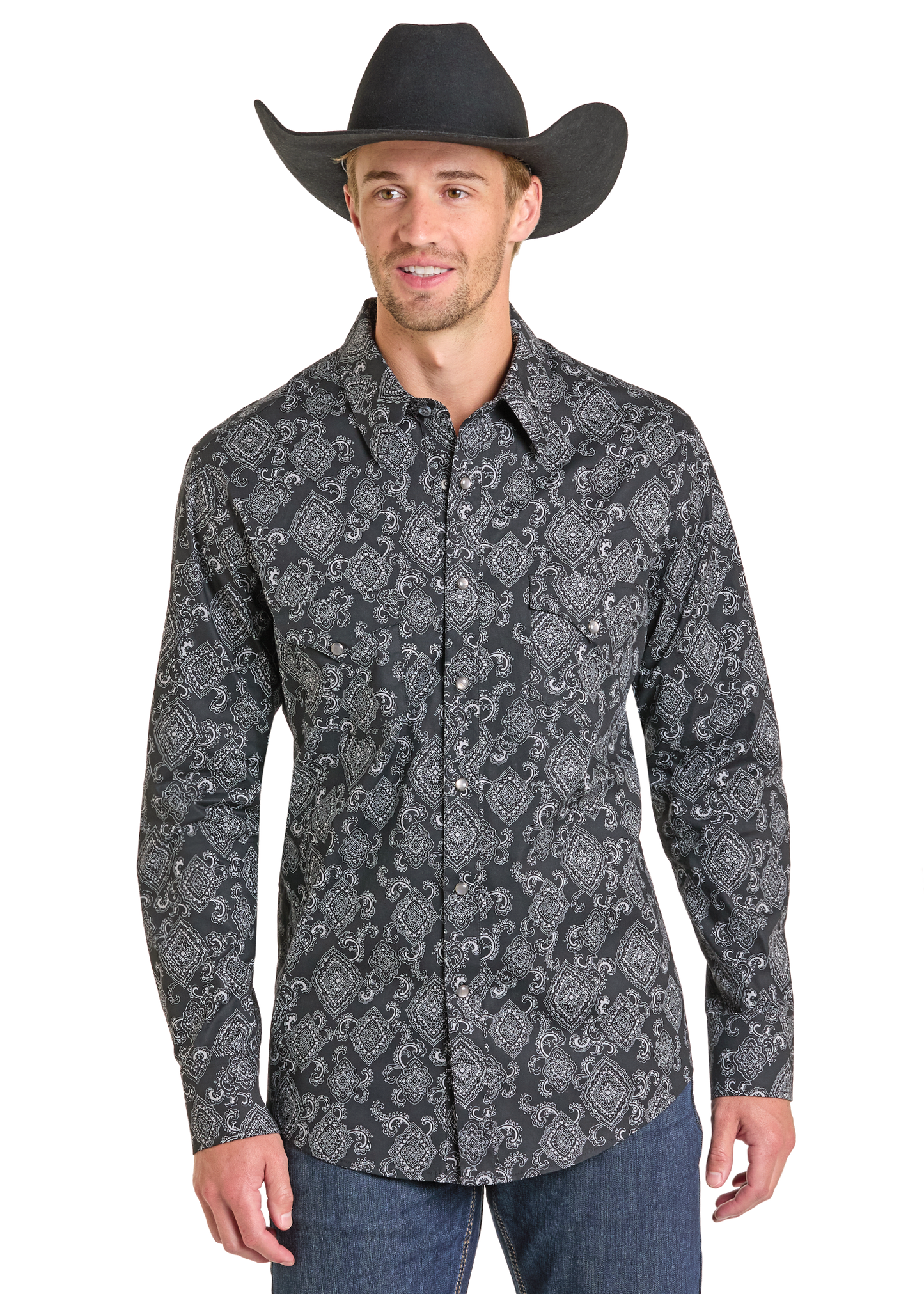 Man wearing cowboy hat and pattern pearl snap shirt. 