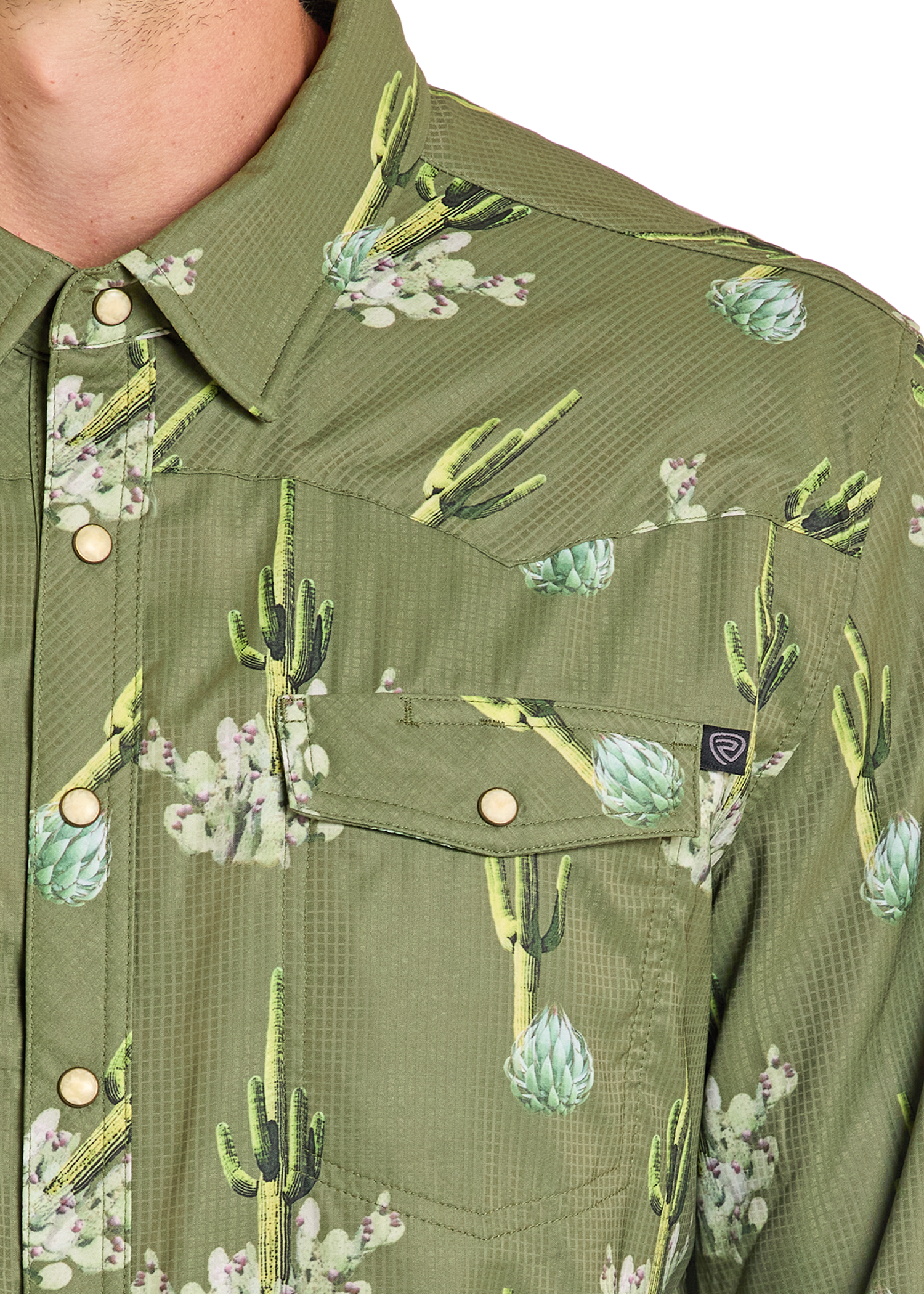 close up of a pocket on a  pearl snap shirt 