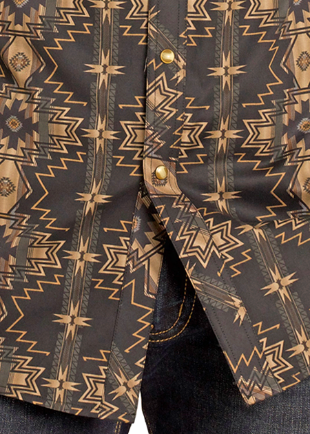 Man wearing a patterned shirt and cowboy hat on a white background