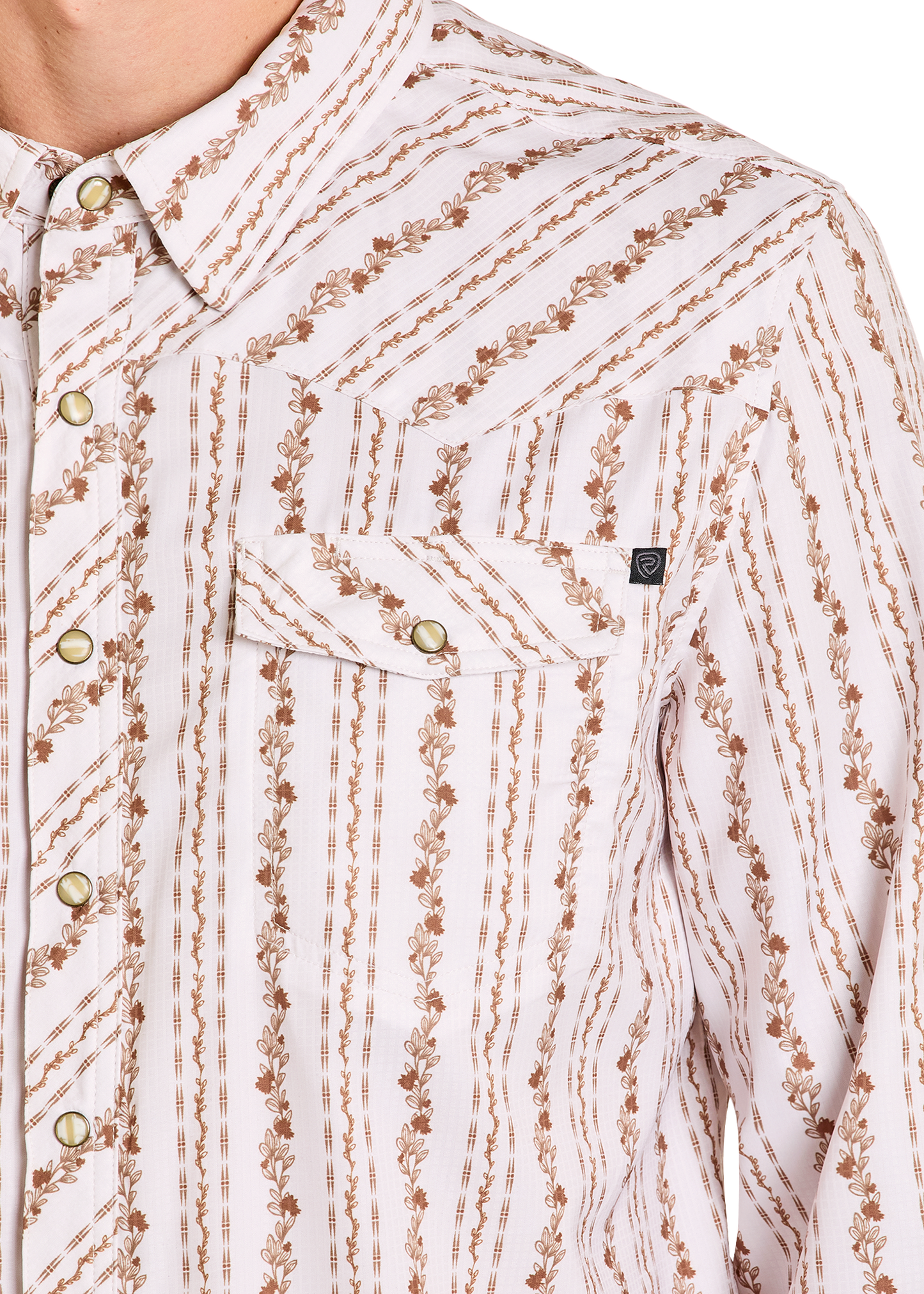 Close-up of a patterned shirt with brown and beige design on a white background
