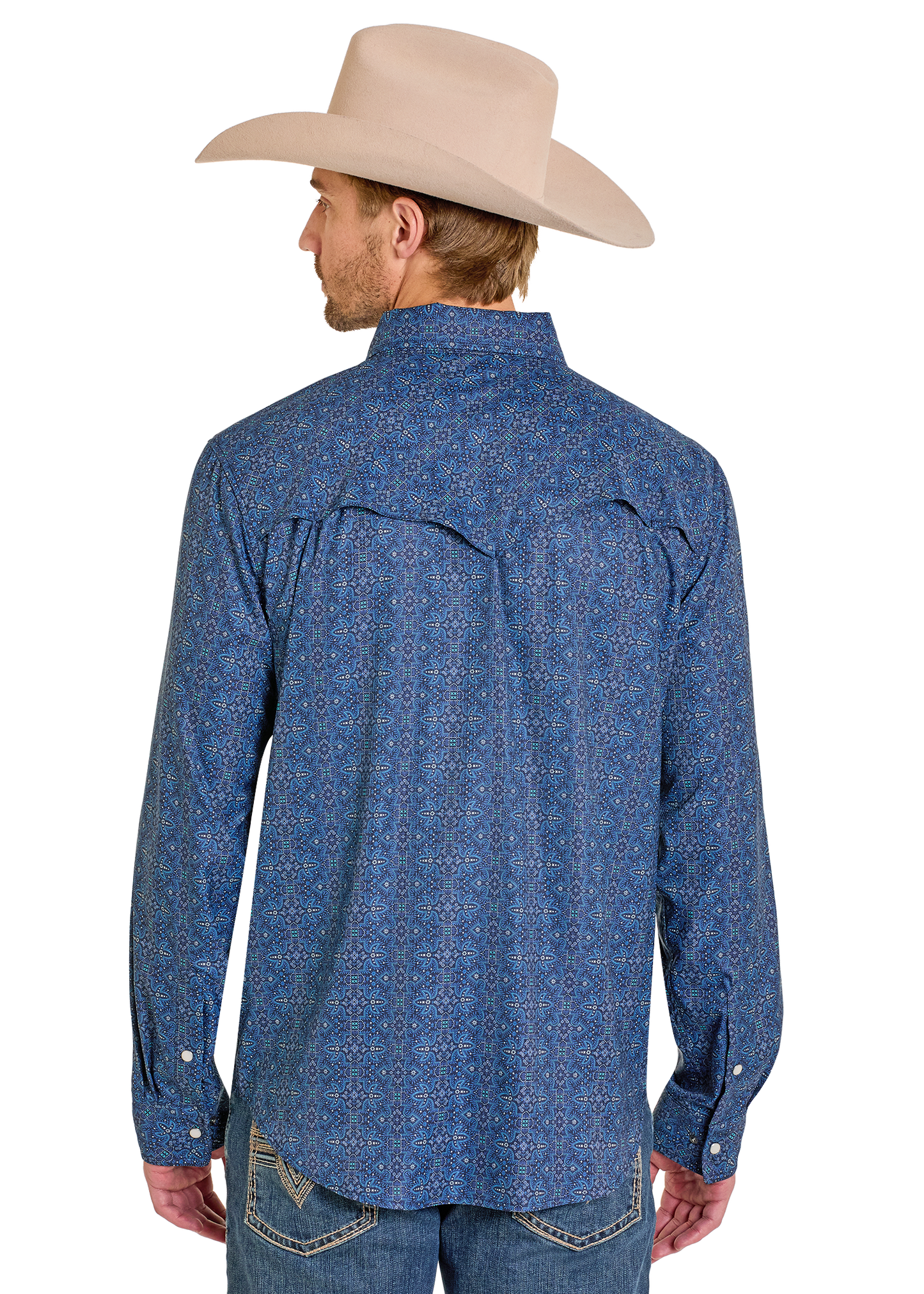 Man wearing a blue patterned shirt and beige cowboy hat on a white background