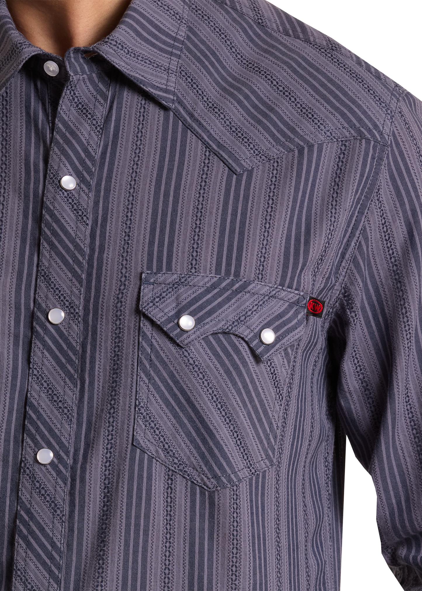 Close-up of a striped shirt with a pocket and buttons on a white background