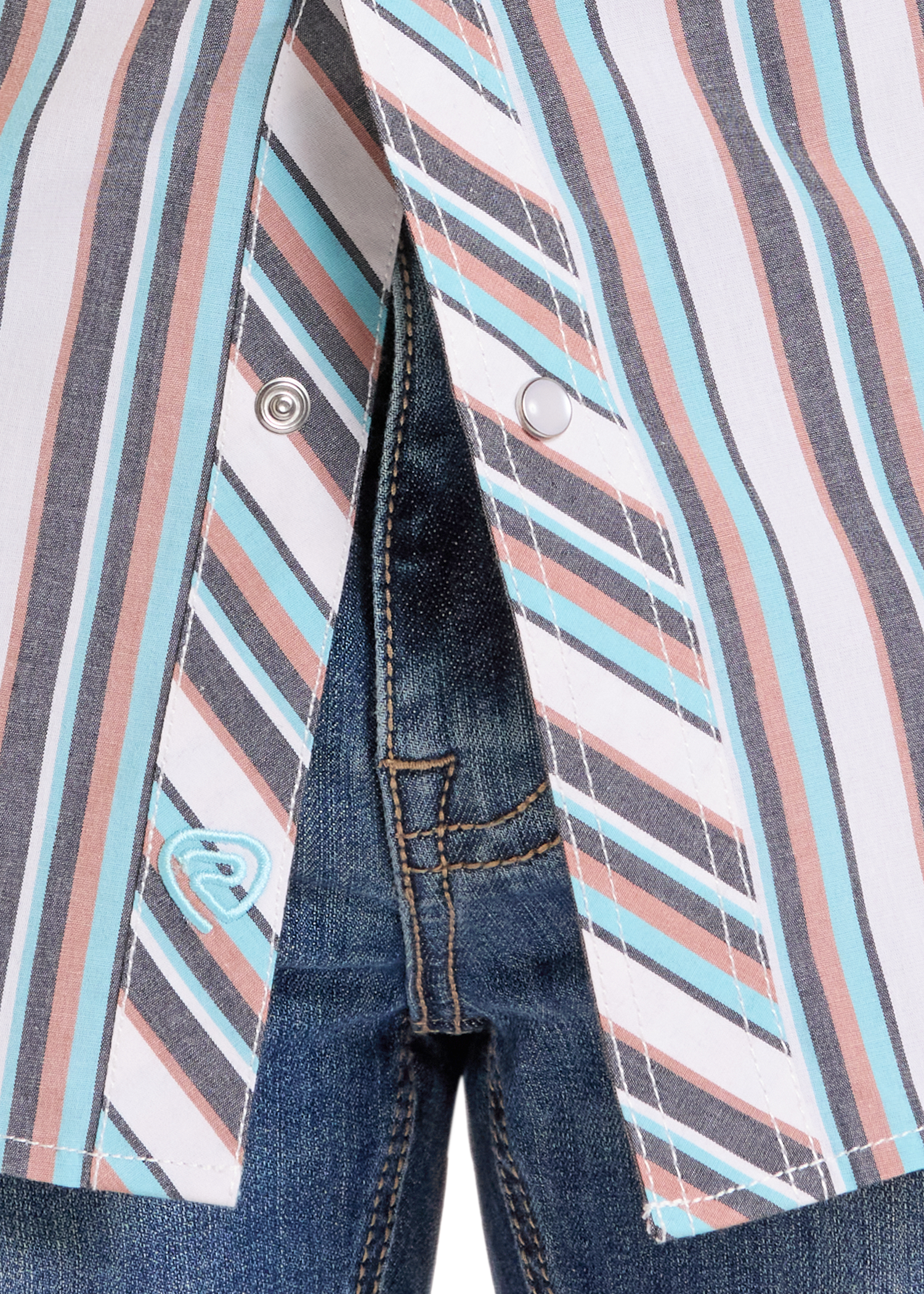 Close-up of a jacket with striped pattern and denim pocket
