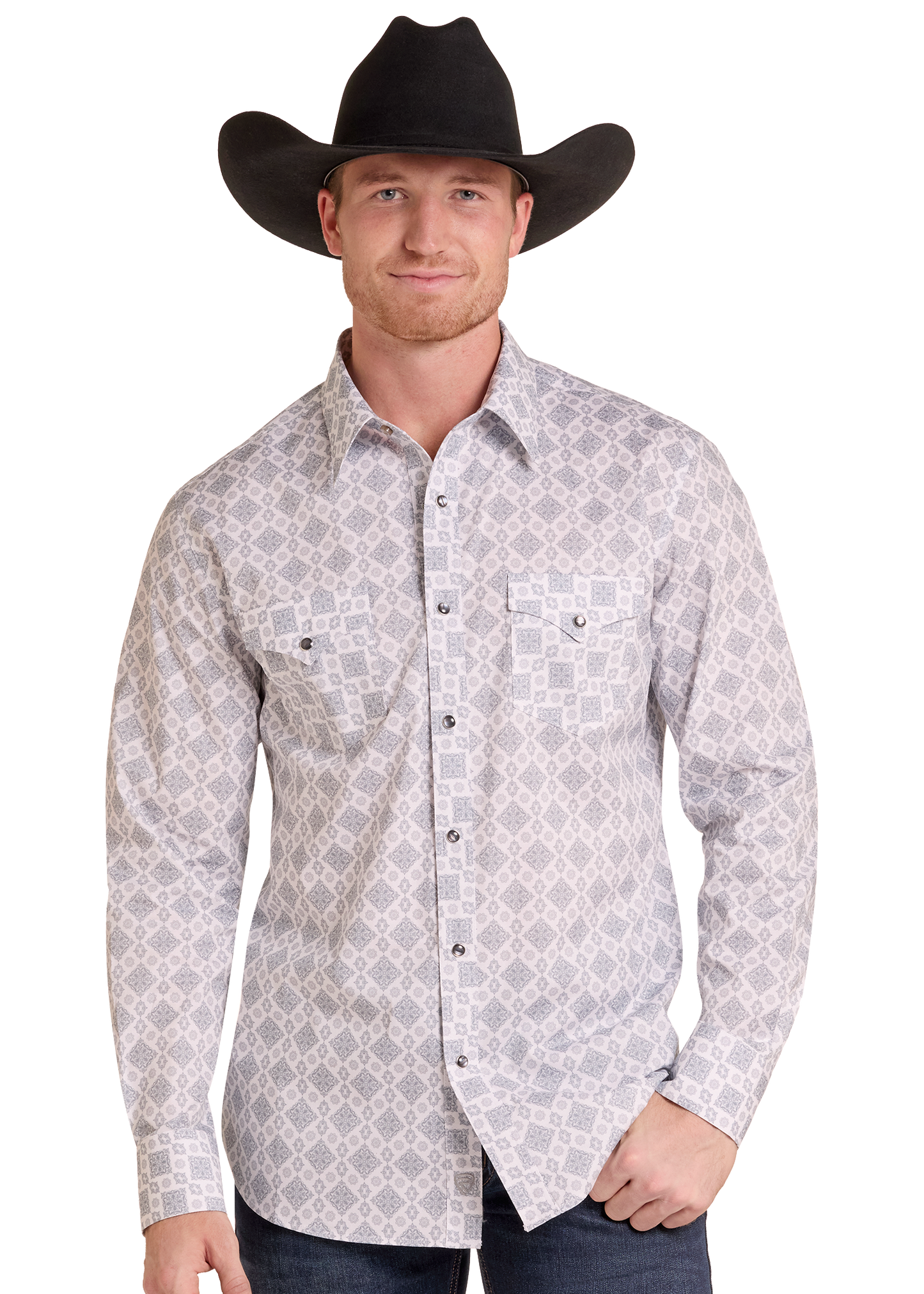 A man wearing a black cowboy hat and a light gray long-sleeve western shirt with a dark gray geometric pattern, paired with dark jeans, against a plain white background.