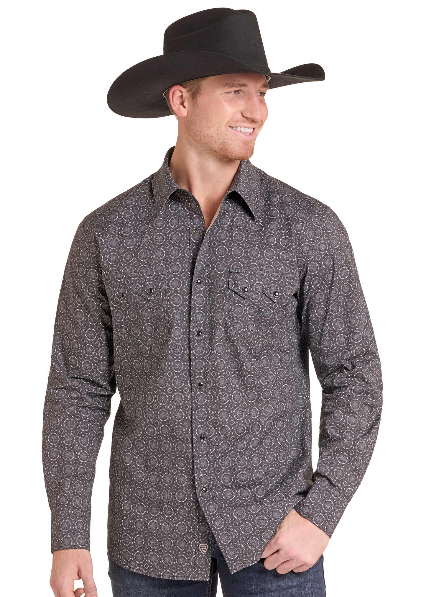 A man wearing a dark gray long-sleeve western button-down shirt with a subtle geometric pattern, paired with a black cowboy hat and blue jeans, shown against a plain white background.