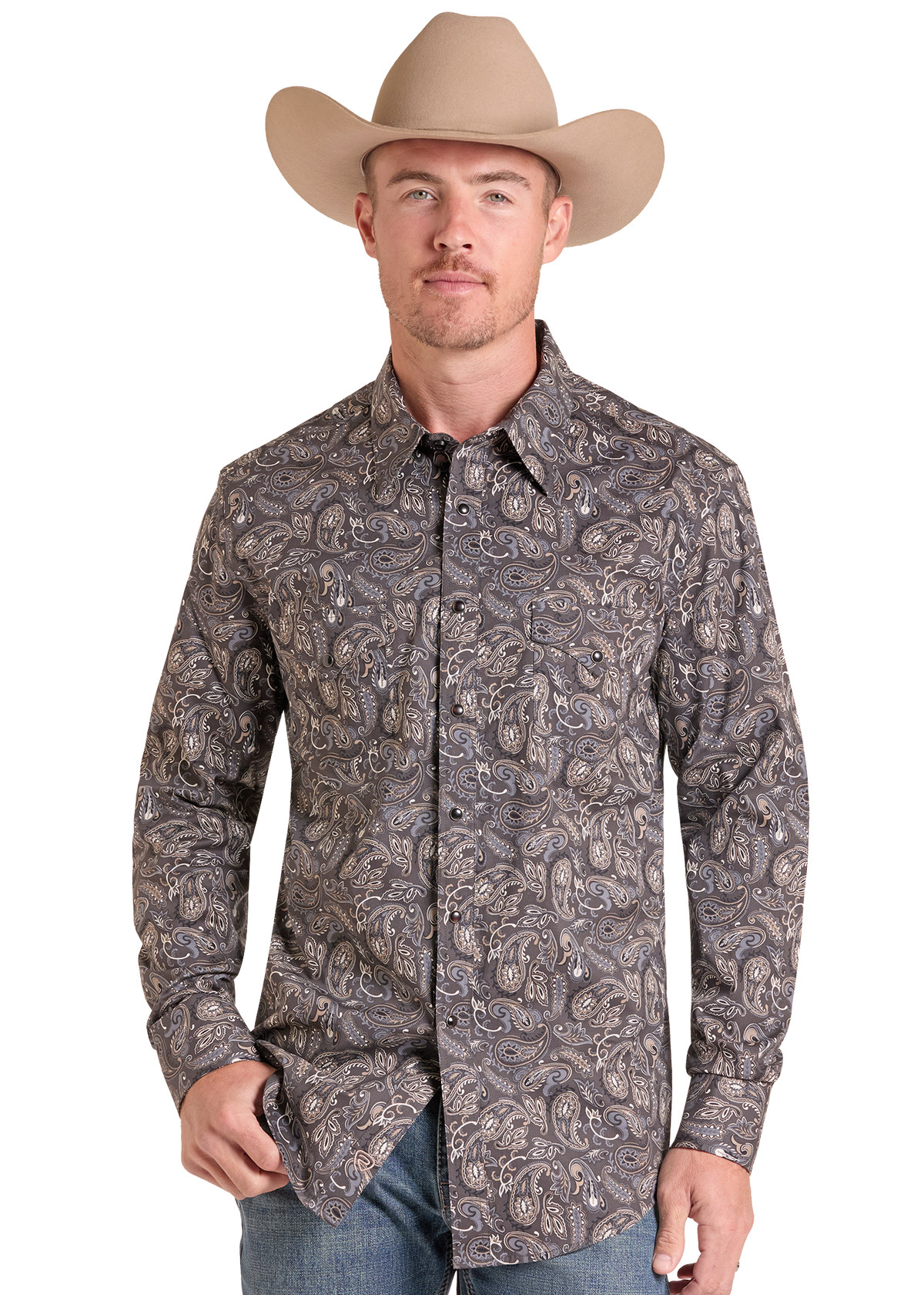 A man wearing a brown and gray paisley western long-sleeve button-down shirt, a beige cowboy hat, and blue jeans, photographed against a plain white background.