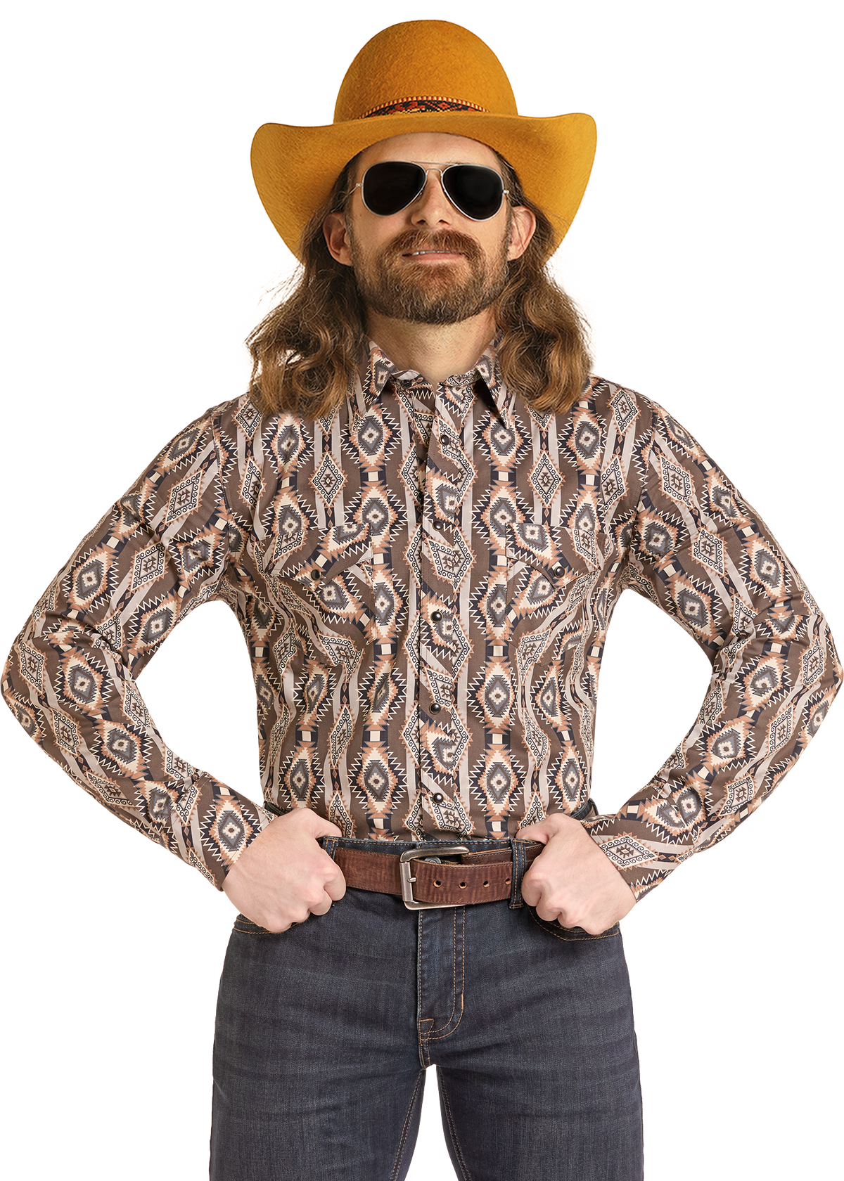 A man wearing a brown and beige patterned long-sleeve western-style button-up shirt, a mustard yellow cowboy hat, dark sunglasses, and a brown belt, posed against a solid white background.