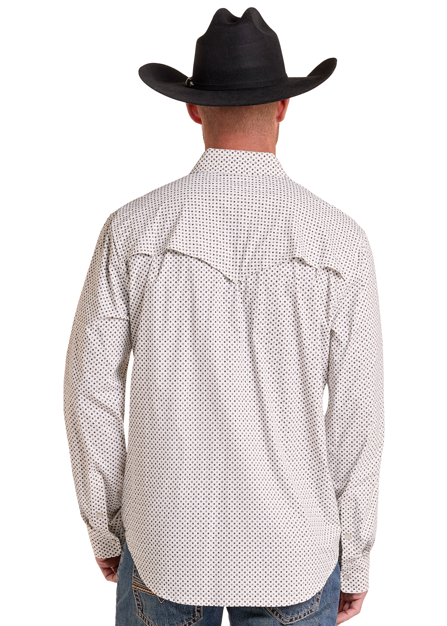A man viewed from the back wearing a black cowboy hat, a white long-sleeve button-up shirt with a small black geometric pattern, and blue jeans against a plain white background.