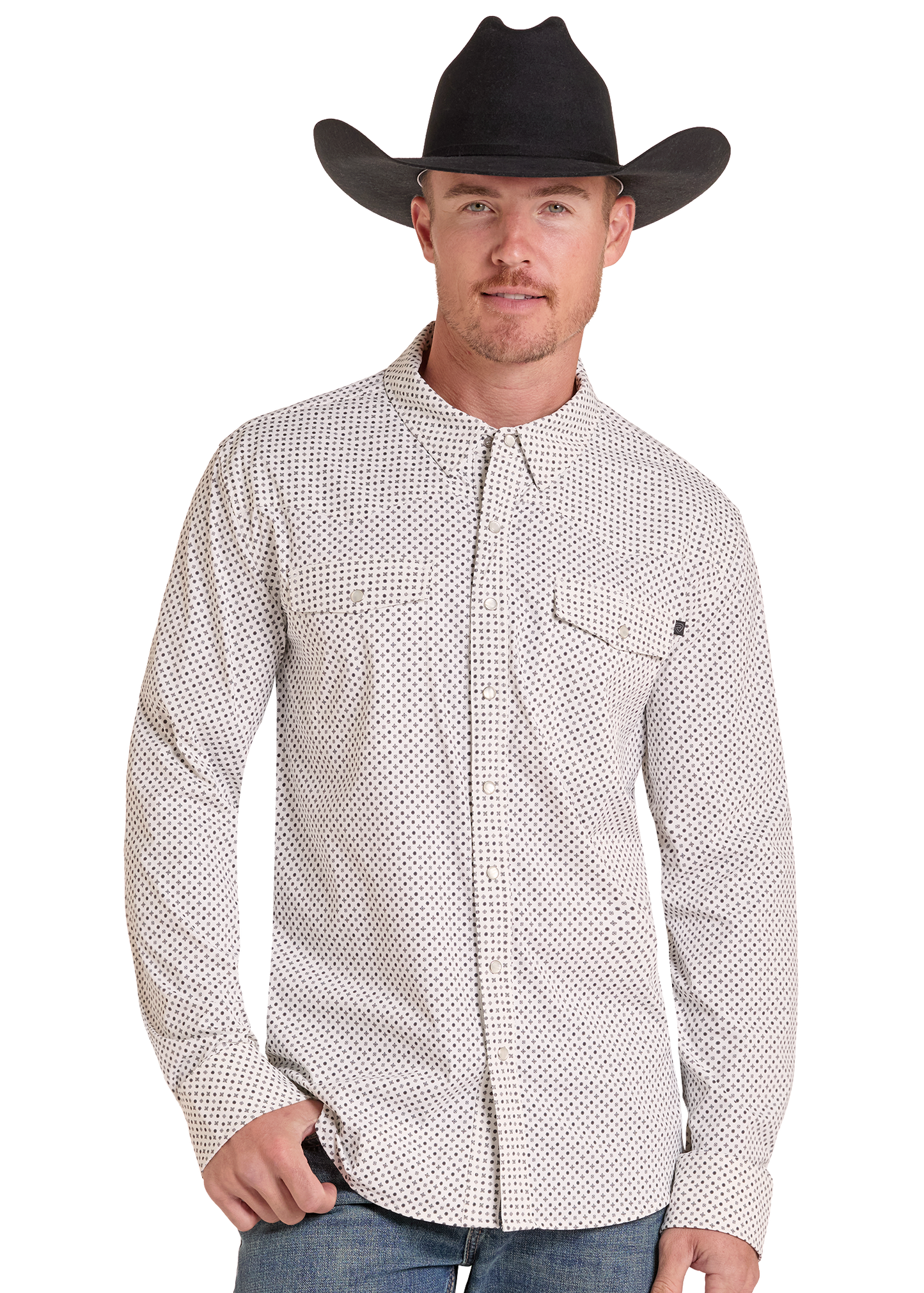 A man wearing a black cowboy hat and a white long-sleeve button-down shirt with a small black geometric pattern, paired with blue jeans, photographed against a solid white background.