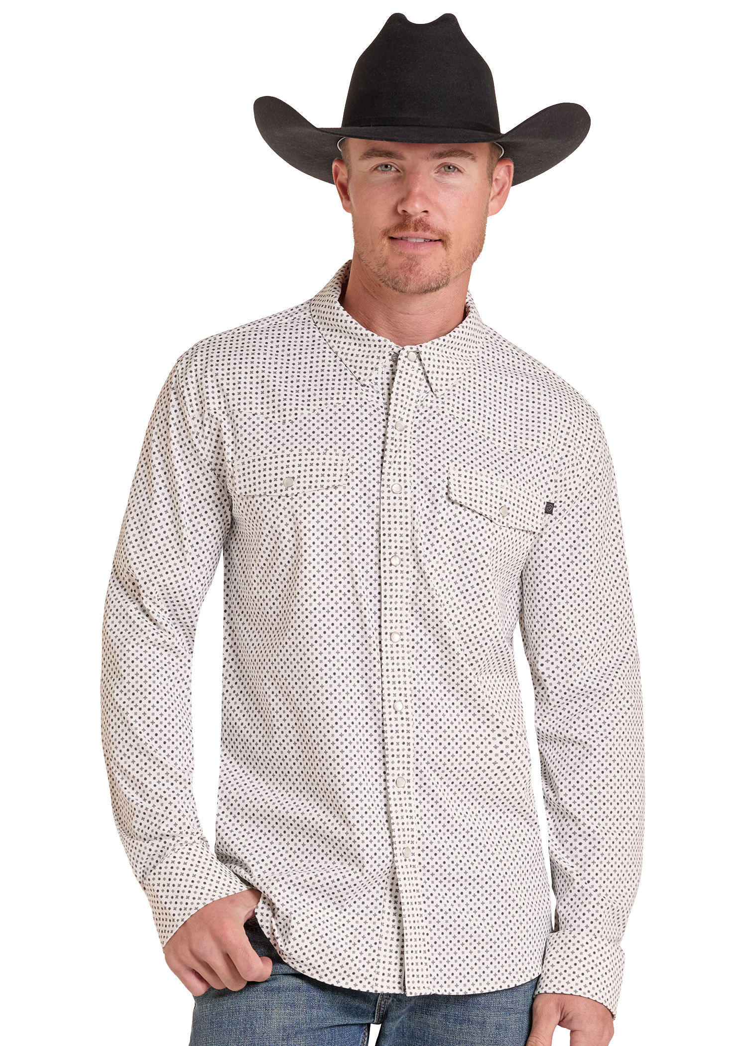 A man wearing a black cowboy hat and a white long-sleeve button-down shirt with a small black geometric pattern, paired with blue jeans, photographed against a solid white background.