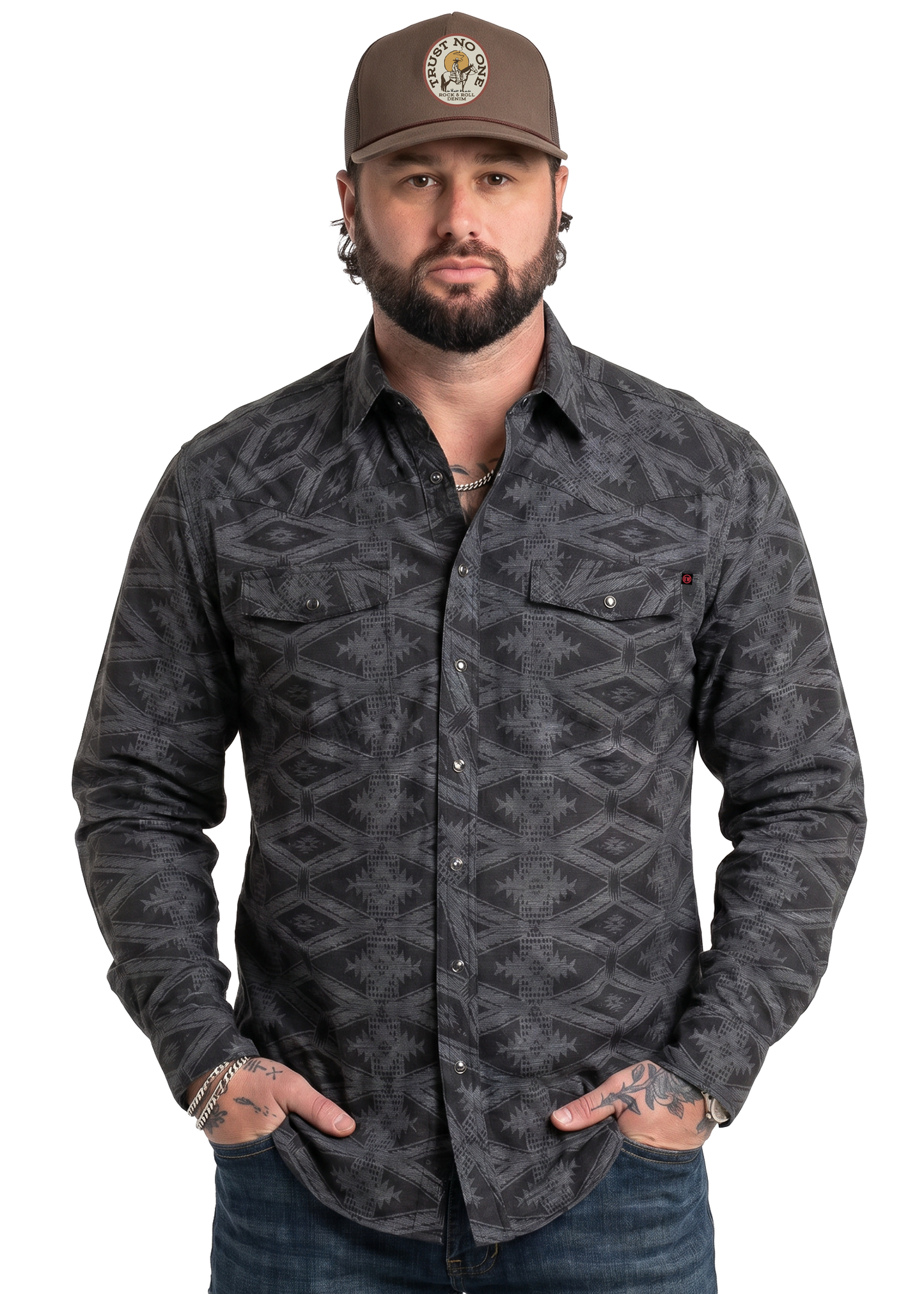 Koe Wetzel wearing a patterned shirt and cap on a white background