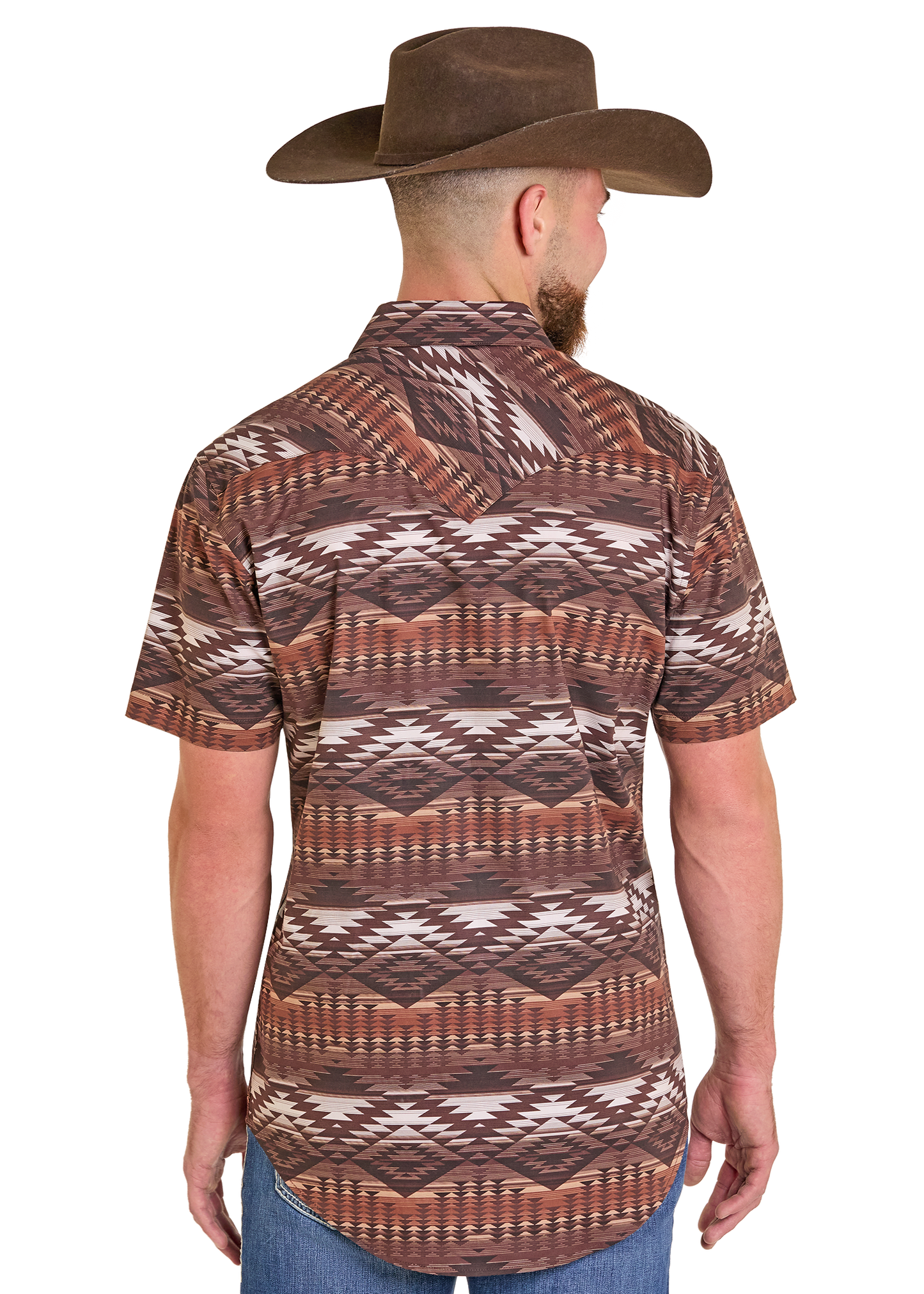 A man wearing a Rock & Roll Denim Slim Fit Brown Aztec Short Sleeve Snap Shirt (size S), blue jeans, and a brown cowboy hat stands with his back to the camera against a plain white background.