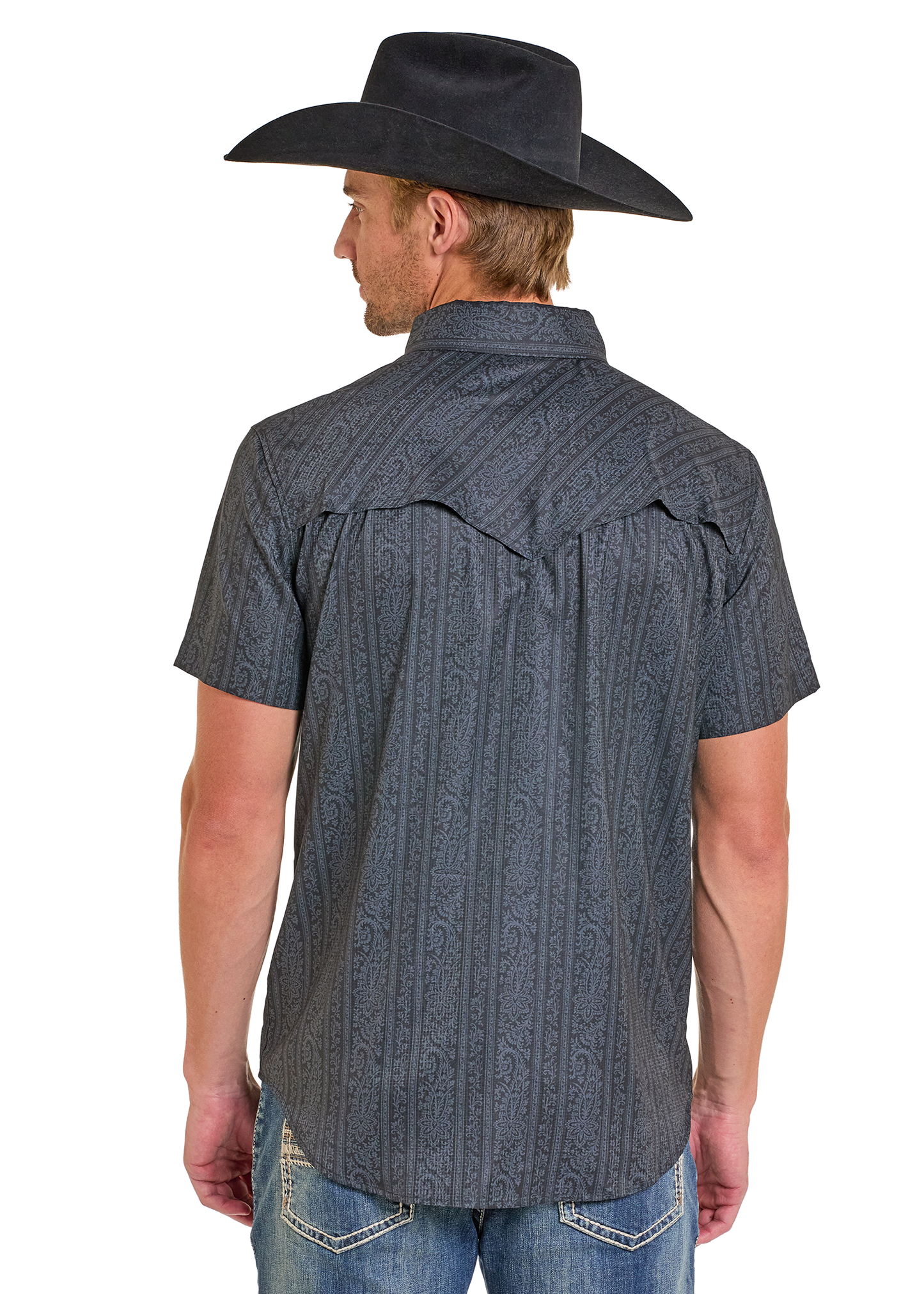 Man wearing a dark patterned short-sleeve shirt and cowboy hat on a white background