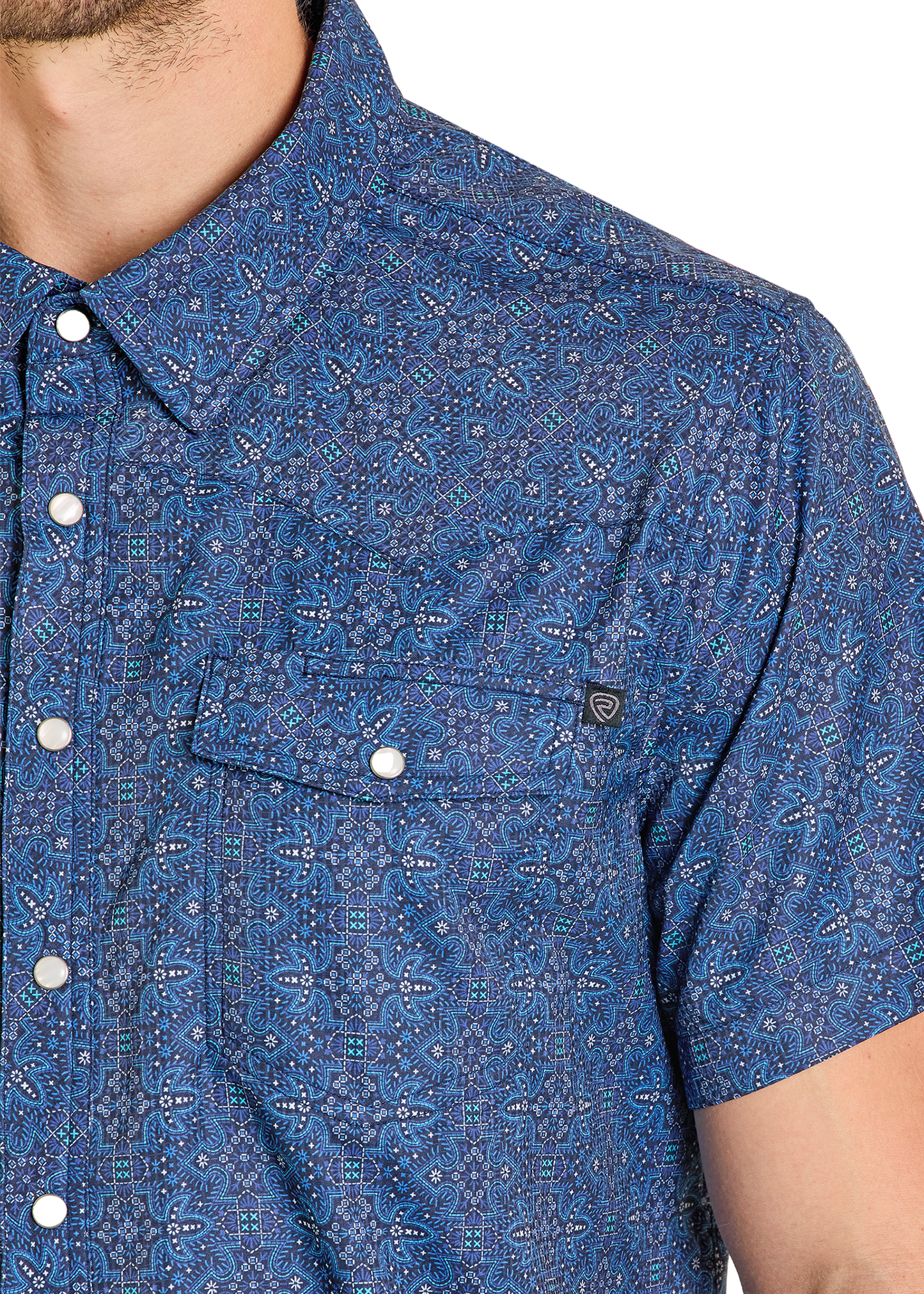 Blue patterned shirt worn by a person