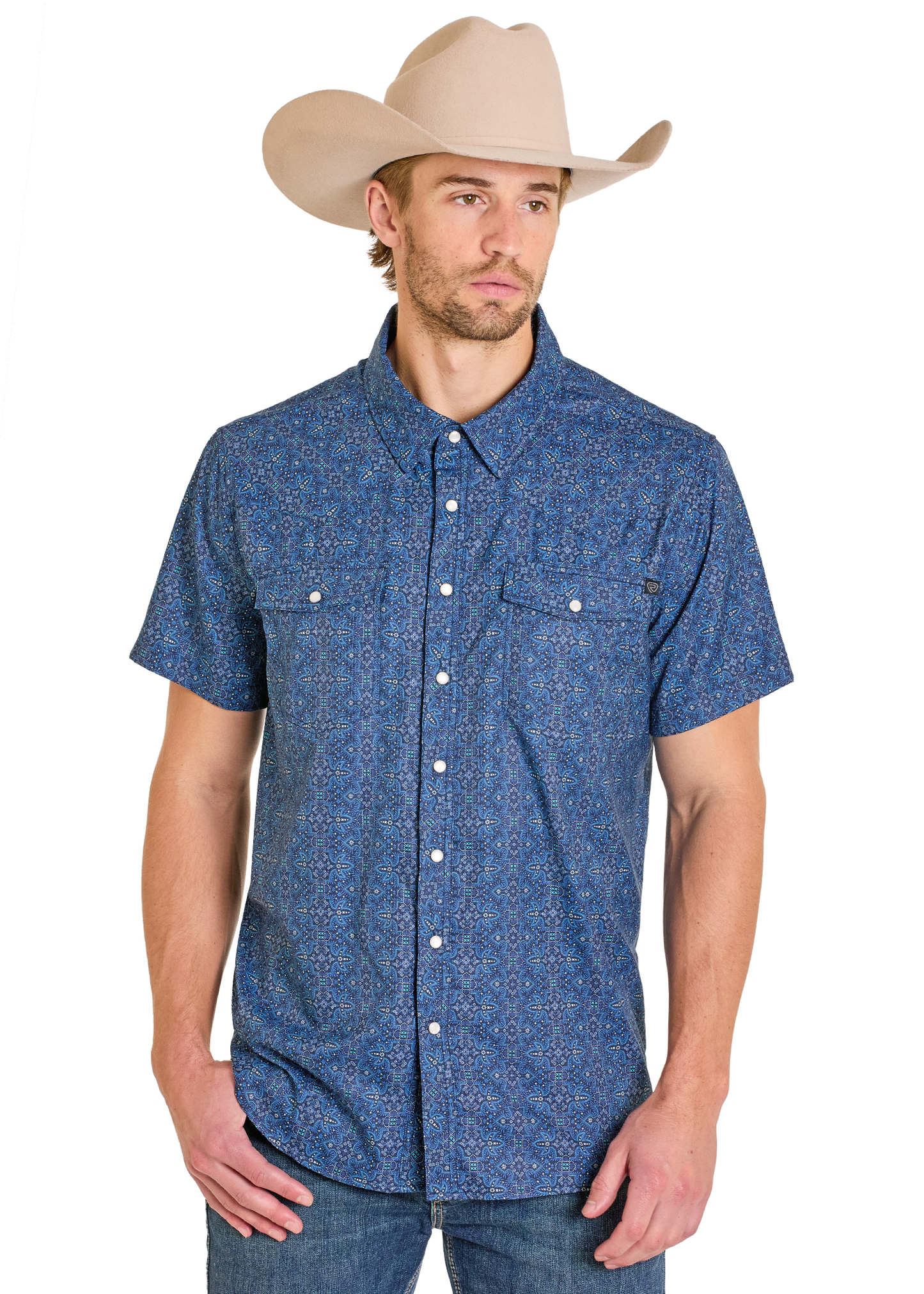 Man wearing a blue patterned shirt and beige cowboy hat on a white background